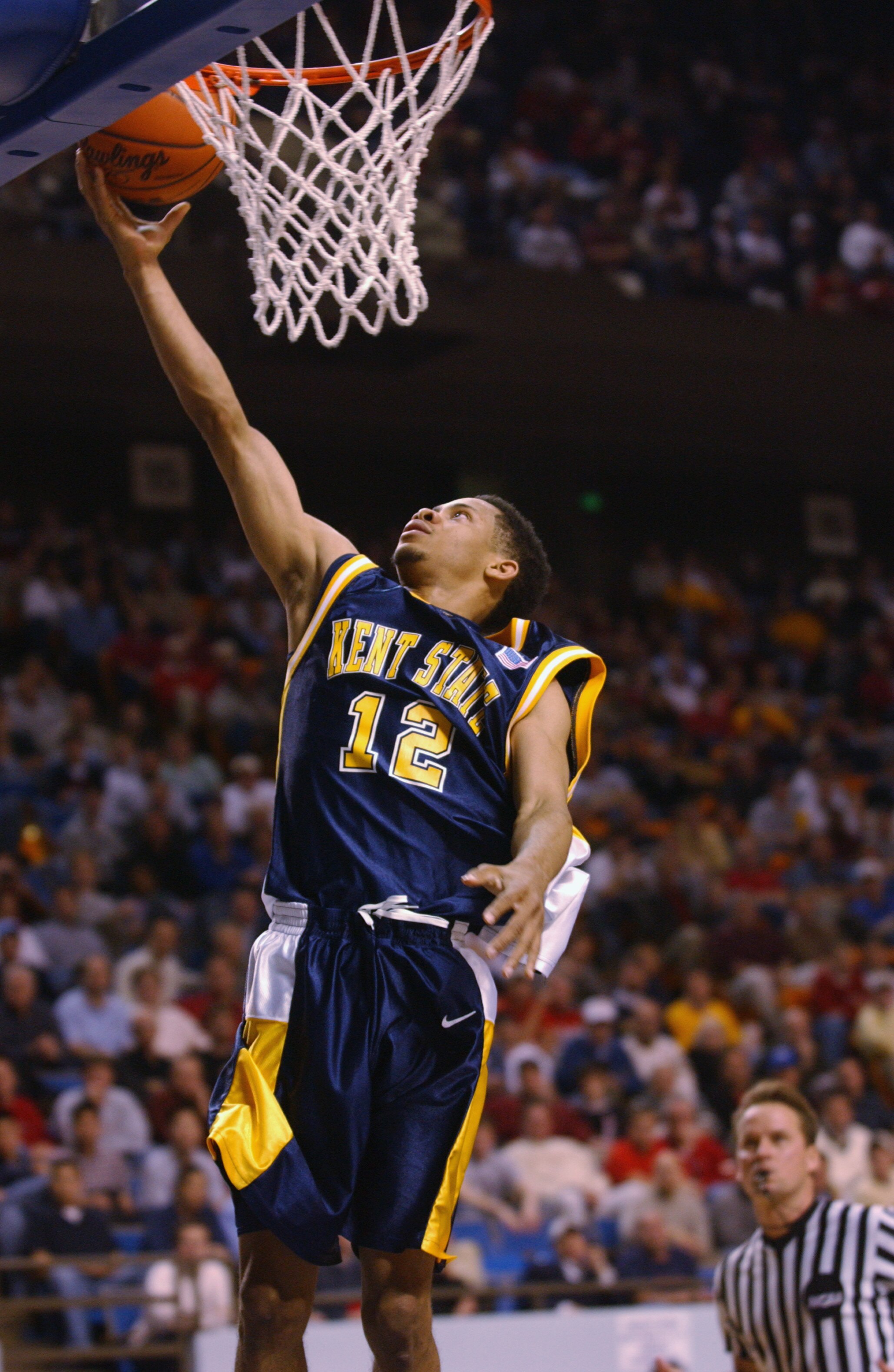 LEXINGTON, KY - MARCH 21:  Andrew Mitchell #12 of the Kent State Golden Flashes lays a shot up during the Midwest Regional Semifinal during the 2002 NCAA Men's Basketball Tournament against the Pittsburgh Panthers on March 21, 2002 at Rupp Arena in Lexing