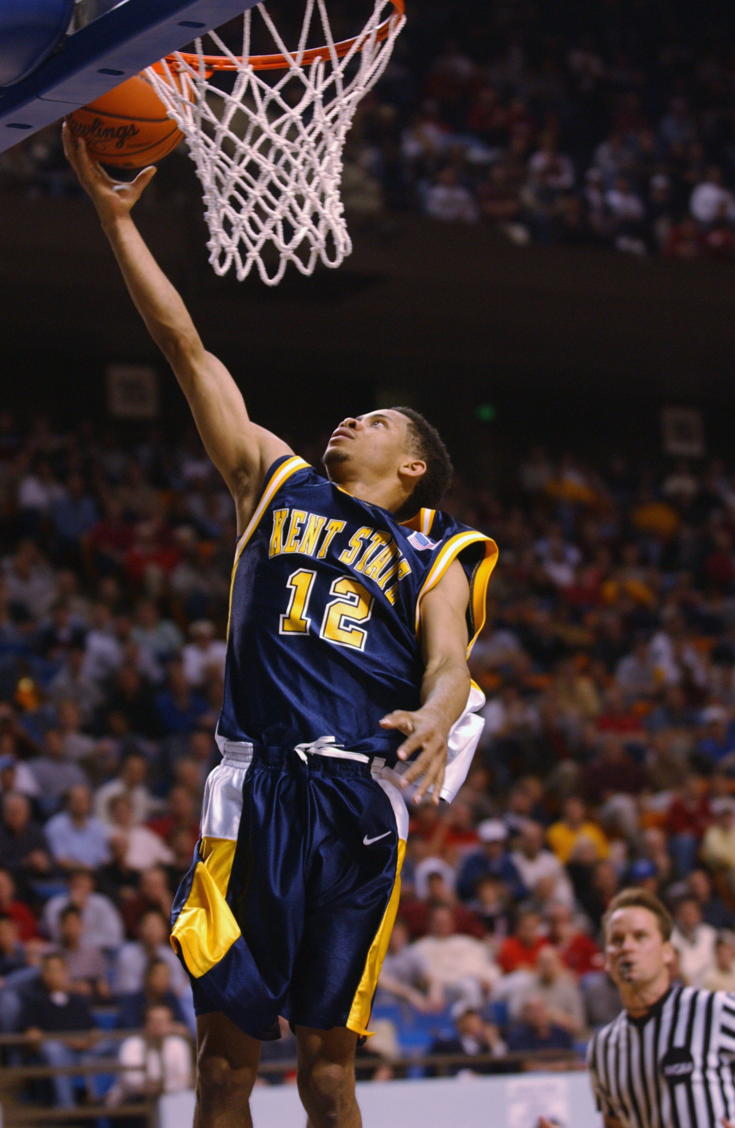 LEXINGTON, KY - MARCH 21:  Andrew Mitchell #12 of the Kent State Golden Flashes lays a shot up during the Midwest Regional Semifinal during the 2002 NCAA Men's Basketball Tournament against the Pittsburgh Panthers on March 21, 2002 at Rupp Arena in Lexing