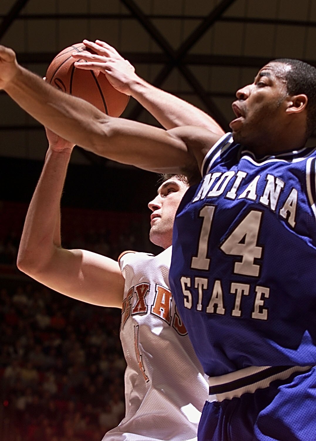 16 Mar 2000: Chris Mihm #4 of the Texas Longhorns pulls down a rebound over Kelyn Block #14 of the Indiana State Sycamores during the first round of the NCAA West tournament in the Huntsman Center at the University of Utah in Salt Lake City, Utah. Texas w