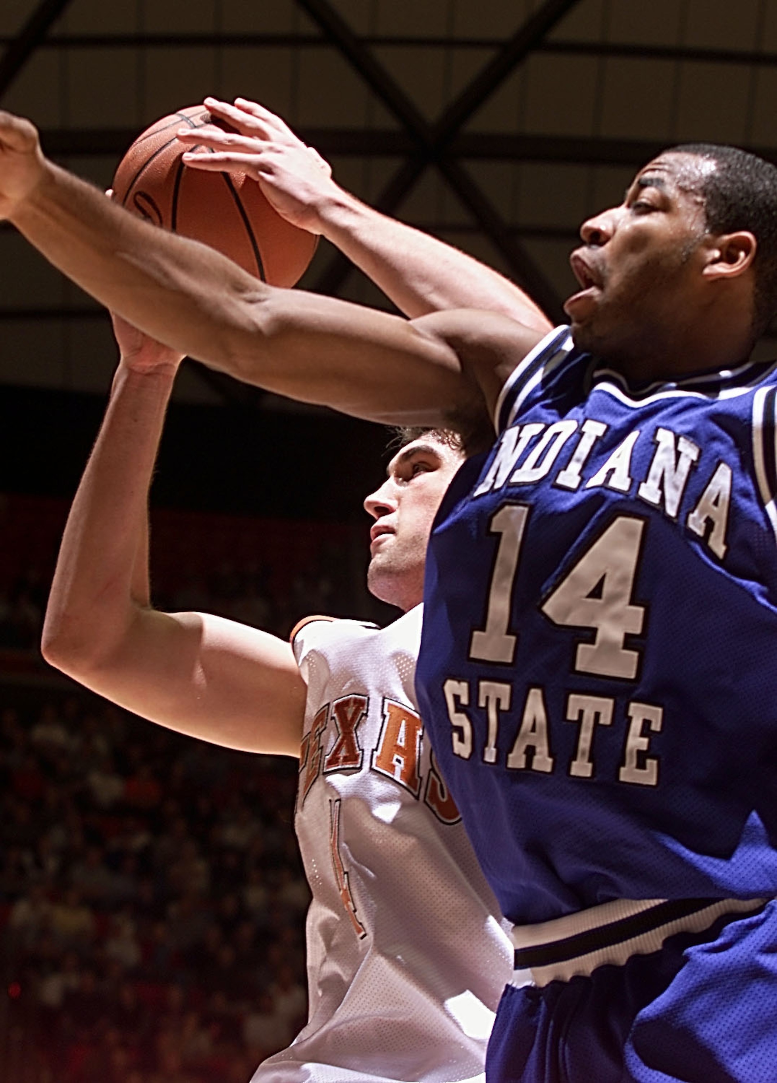 16 Mar 2000: Chris Mihm #4 of the Texas Longhorns pulls down a rebound over Kelyn Block #14 of the Indiana State Sycamores during the first round of the NCAA West tournament in the Huntsman Center at the University of Utah in Salt Lake City, Utah. Texas w