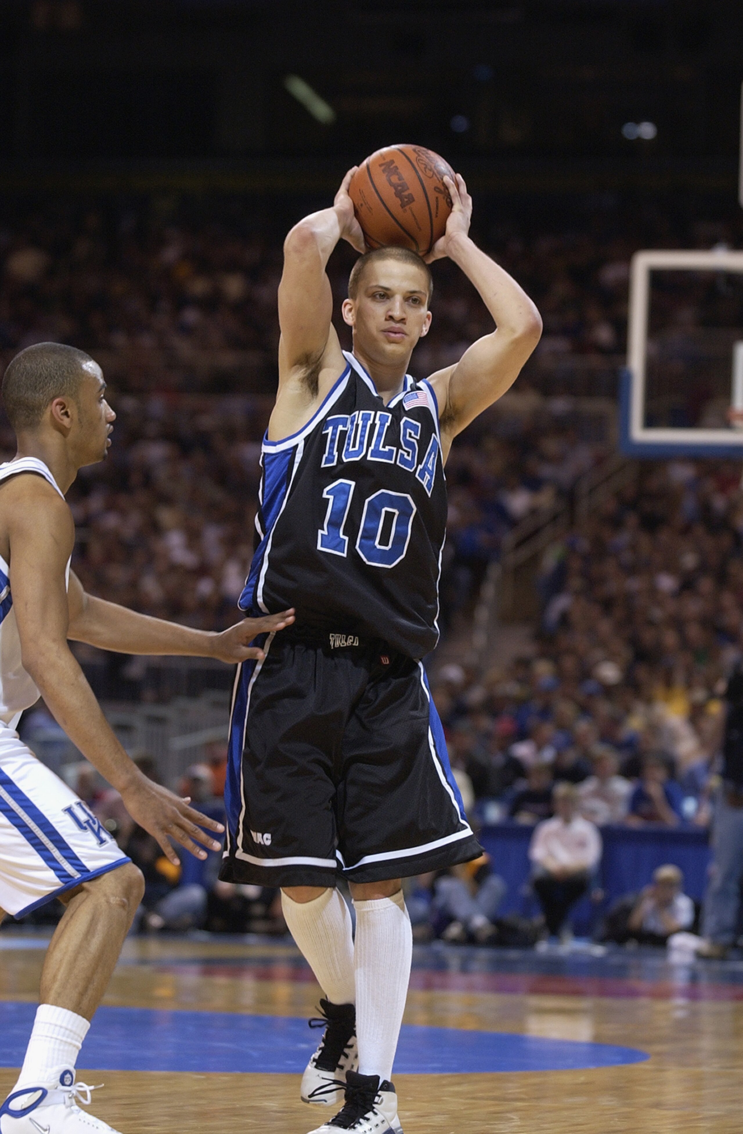 ST. LOUIS - MARCH 16:  Guard Greg Harrington #10 of the Tulsa Golden Hurricanes looks to make a pass against the Kentucky Wildcats during the second round of the 2002 NCAA Division I Men's Basketball Tournament on March 16, 2002 at Edward Jones Dome in St