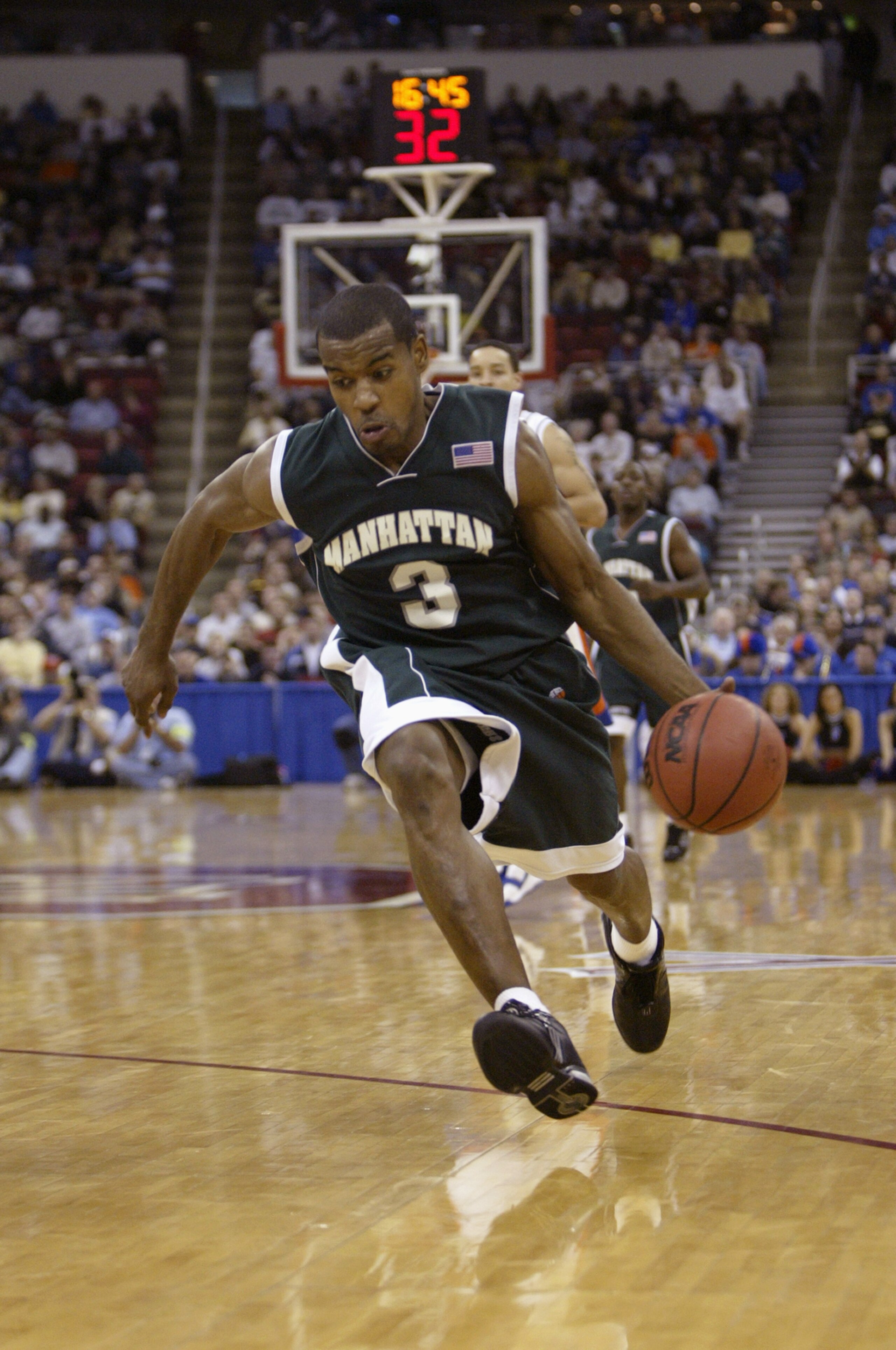 RALEIGH, NC - MARCH 18:  Luis Flores #3 of the Manhattan Jaspers drives during the first round game of the NCAA Division I Men's Basketball Tournament against the Florida Gators at the RBC Center on March 18, 2004 in Raleigh, North Carolina. The Jaspers w