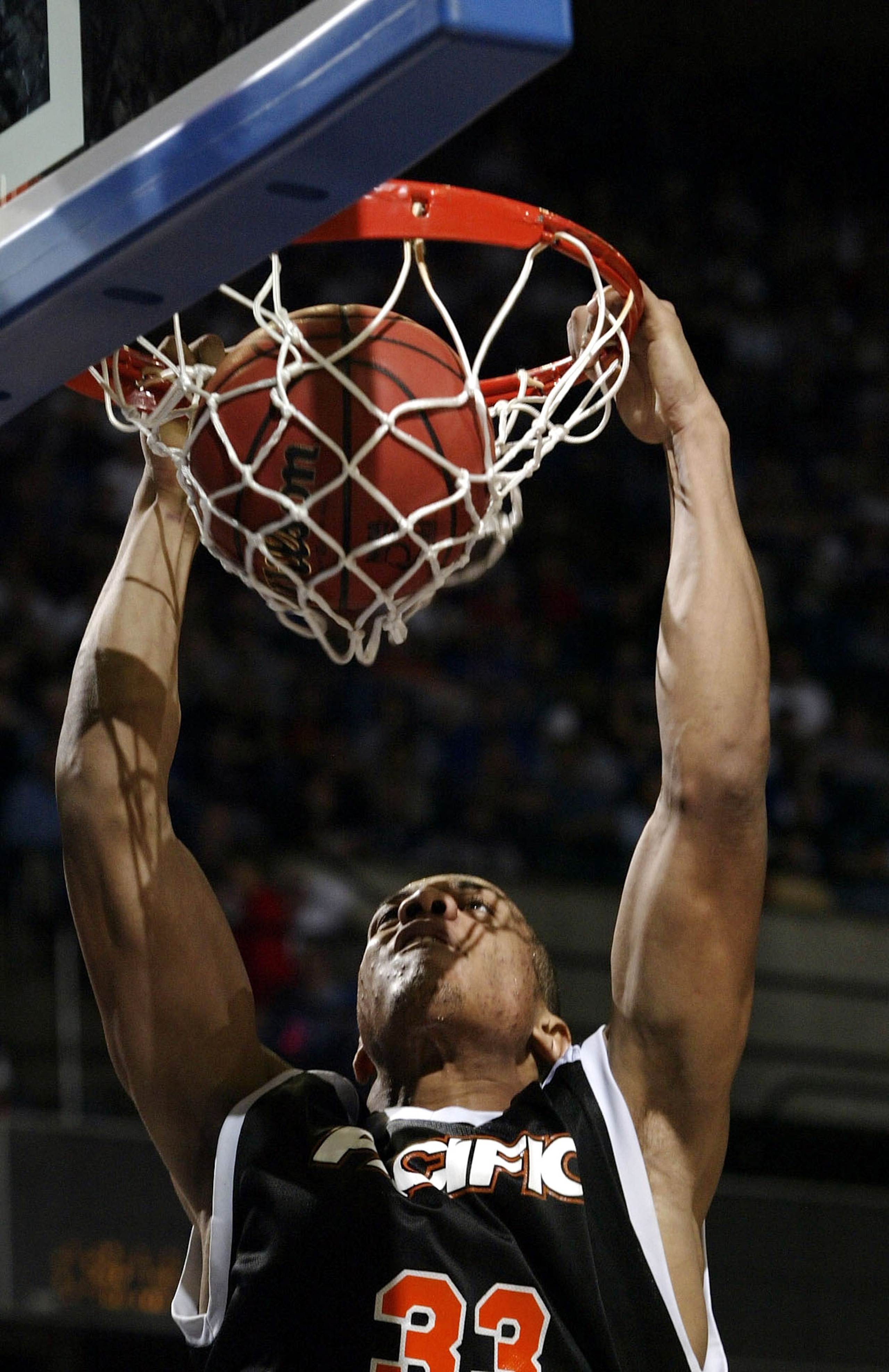 KANSAS CITY - MARCH 19: Guillaume Yango #33 of the Pacific Tigers dunks in the second half against the Providence Friars during the first round game of the NCAA Division I Men's Basketball Tournament at Kemper Arena on March 19, 2004 in Kansas City, Misso