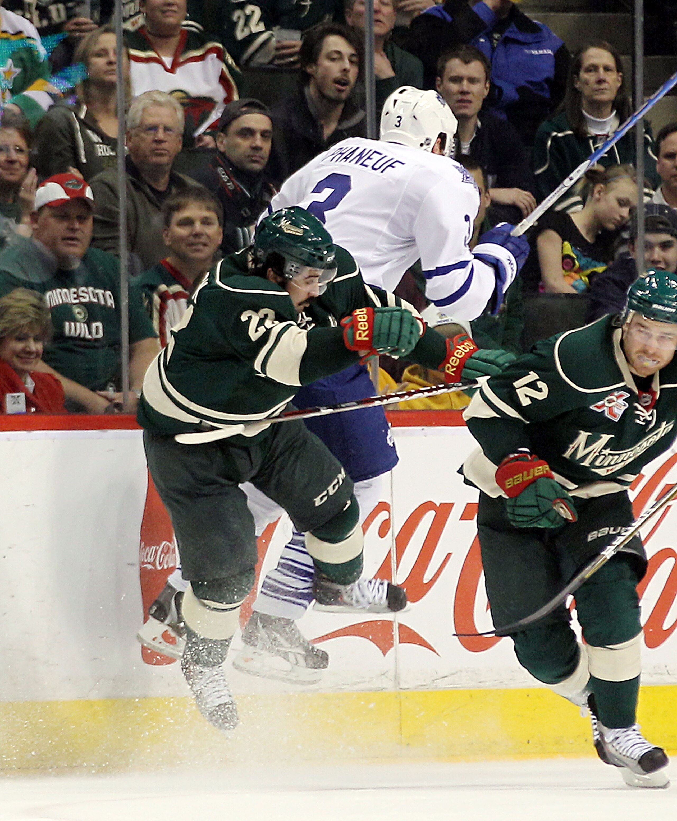 ST PAUL, MN - MARCH 22: Cal Clutterbuck #22 of the Minnesota Wild hits Dion Phaneuf #3 of the Toronto Maple Leafs at the Xcel Energy Center on March 22, 2011 in St Paul, Minnesota. (Photo by Bruce Bennett/Getty Images) ST PAUL, MN - MARCH 22: Cal Clutterbuck #22 of the Minnesota Wild hits Dion Phaneuf #3 of the Toronto Maple Leafs at the Xcel Energy Center on March 22, 2011 in St Paul, Minnesota. (Photo by Bruce Bennett/Getty Images)