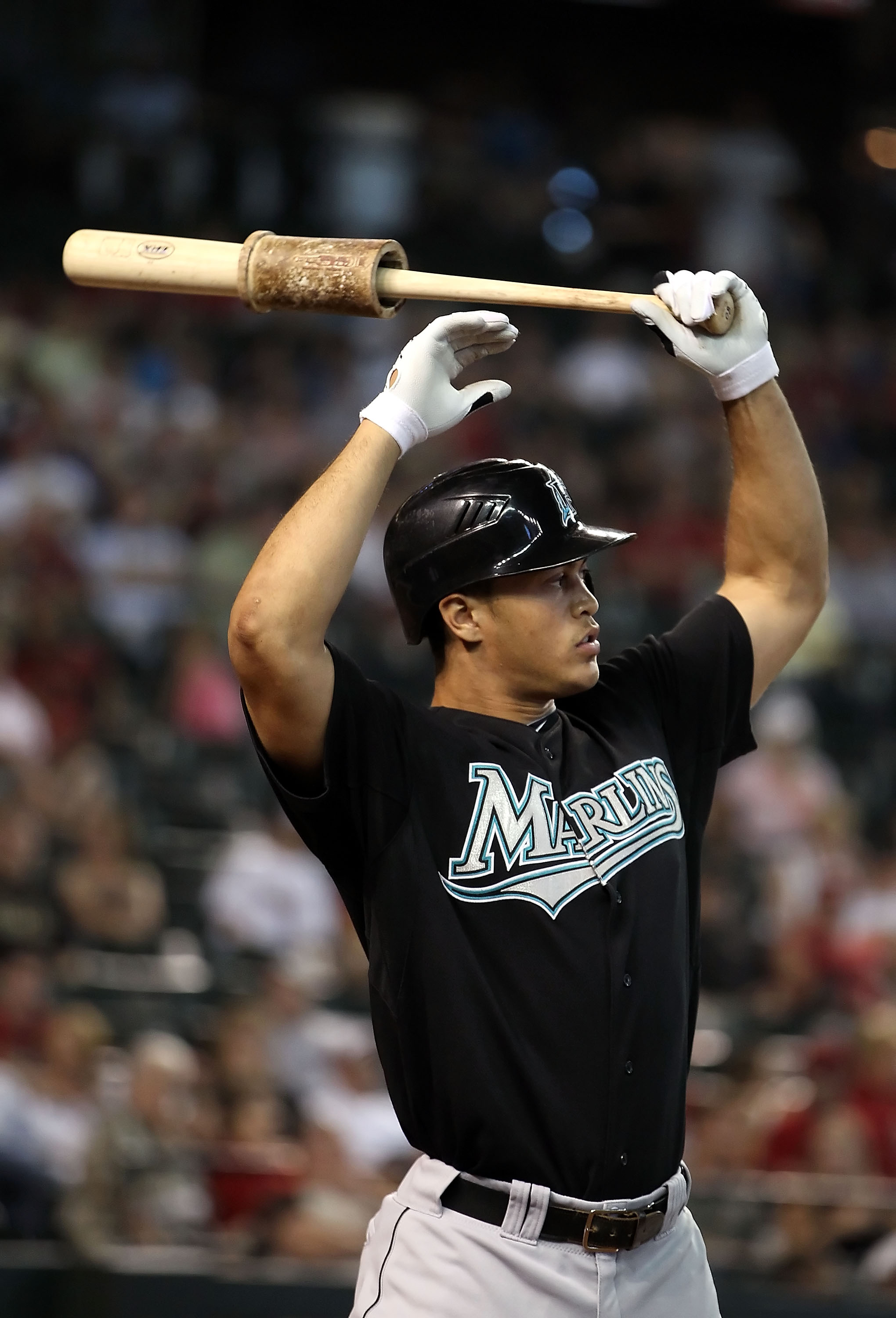 PHOENIX - JULY 11:  Mike Stanton #27 of the Florida Marlins warms up on deck during the Major League Baseball game against the Arizona Diamondbacks at Chase Field on July 11, 2010 in Phoenix, Arizona.  The Marlins defeated the Diamondbacks 2-0.  (Photo by