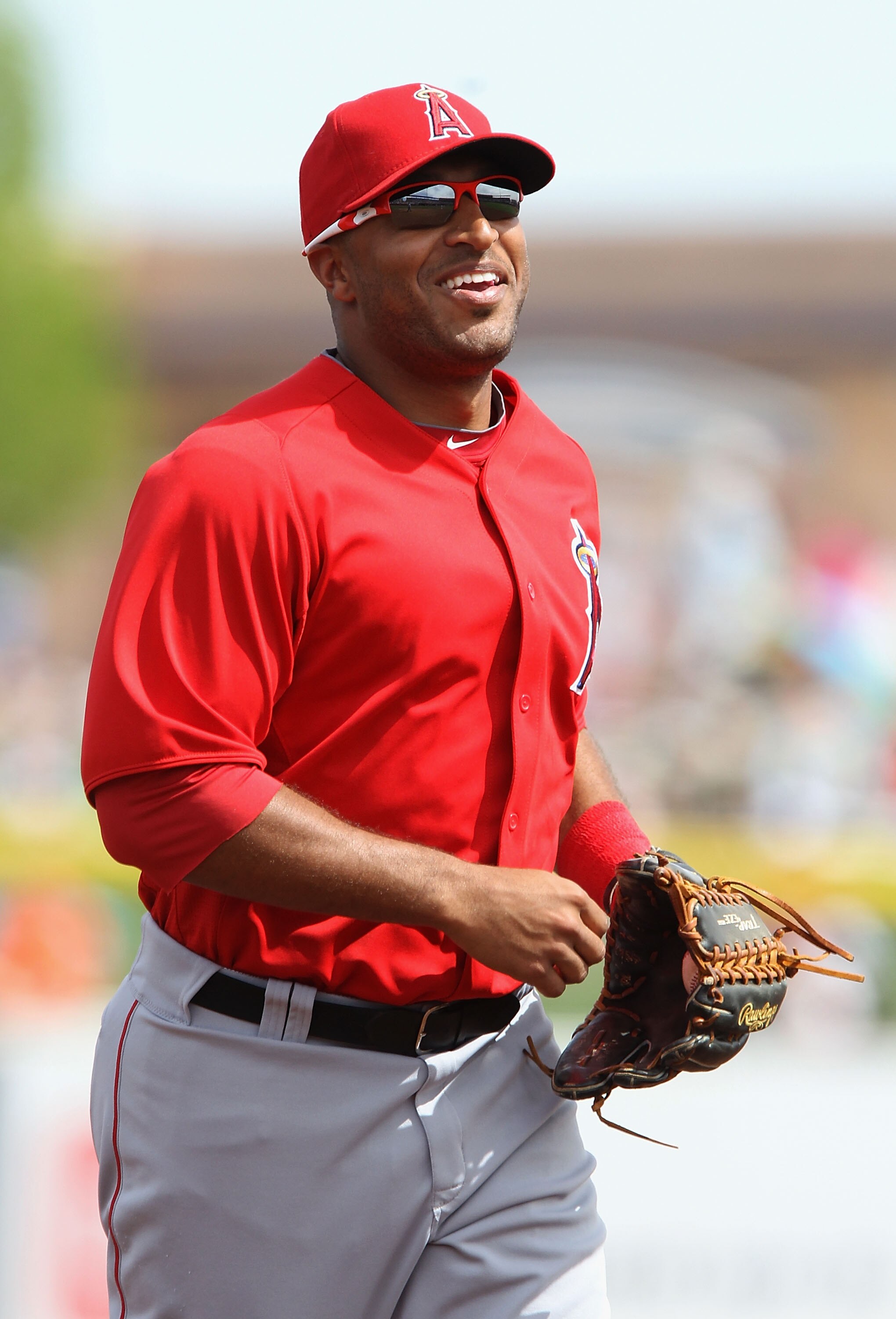 PEORIA, AZ - MARCH 15:  Outfielder Vernon Wells #10 of the Los Angeles Angels of Anaheim runs into the dugout during the spring training game against the San Diego Padres at Peoria Stadium on March 15, 2011 in Peoria, Arizona.  (Photo by Christian Peterse