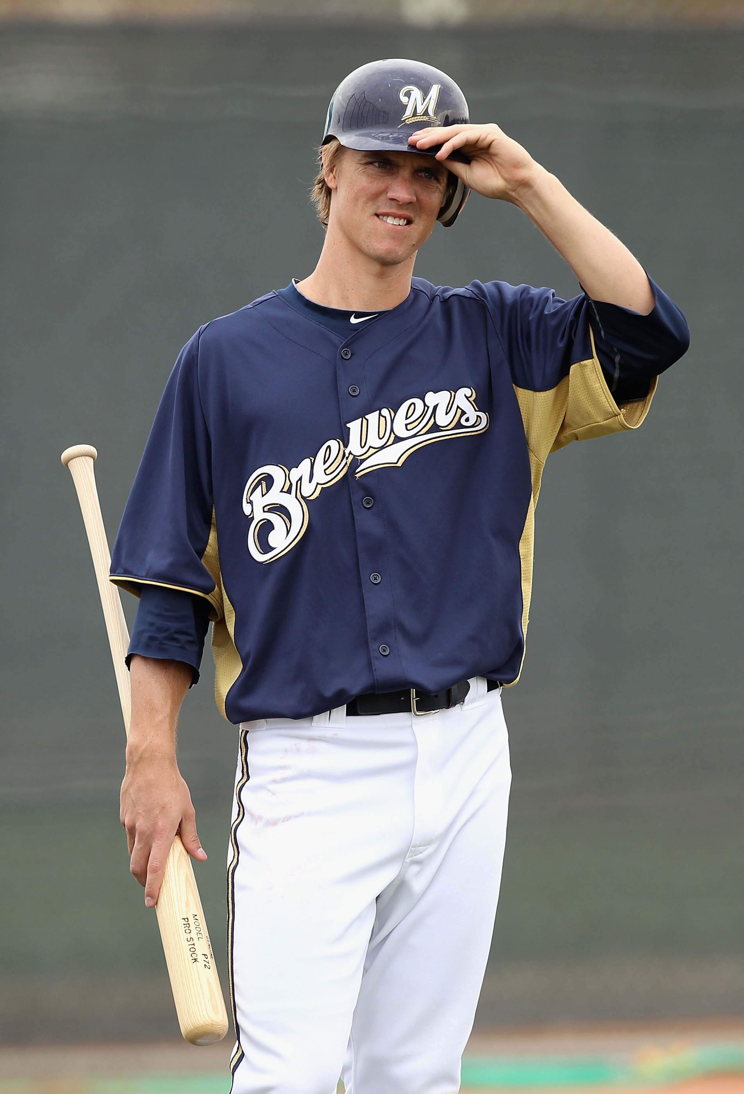 PHOENIX, AZ - FEBRUARY 18:  Zack Greinke #13 of the Milwaukee Brewers participates in bunting drills during a MLB spring training practice at Maryvale Baseball Park on February 18, 2011 in Phoenix, Arizona.  (Photo by Christian Petersen/Getty Images)