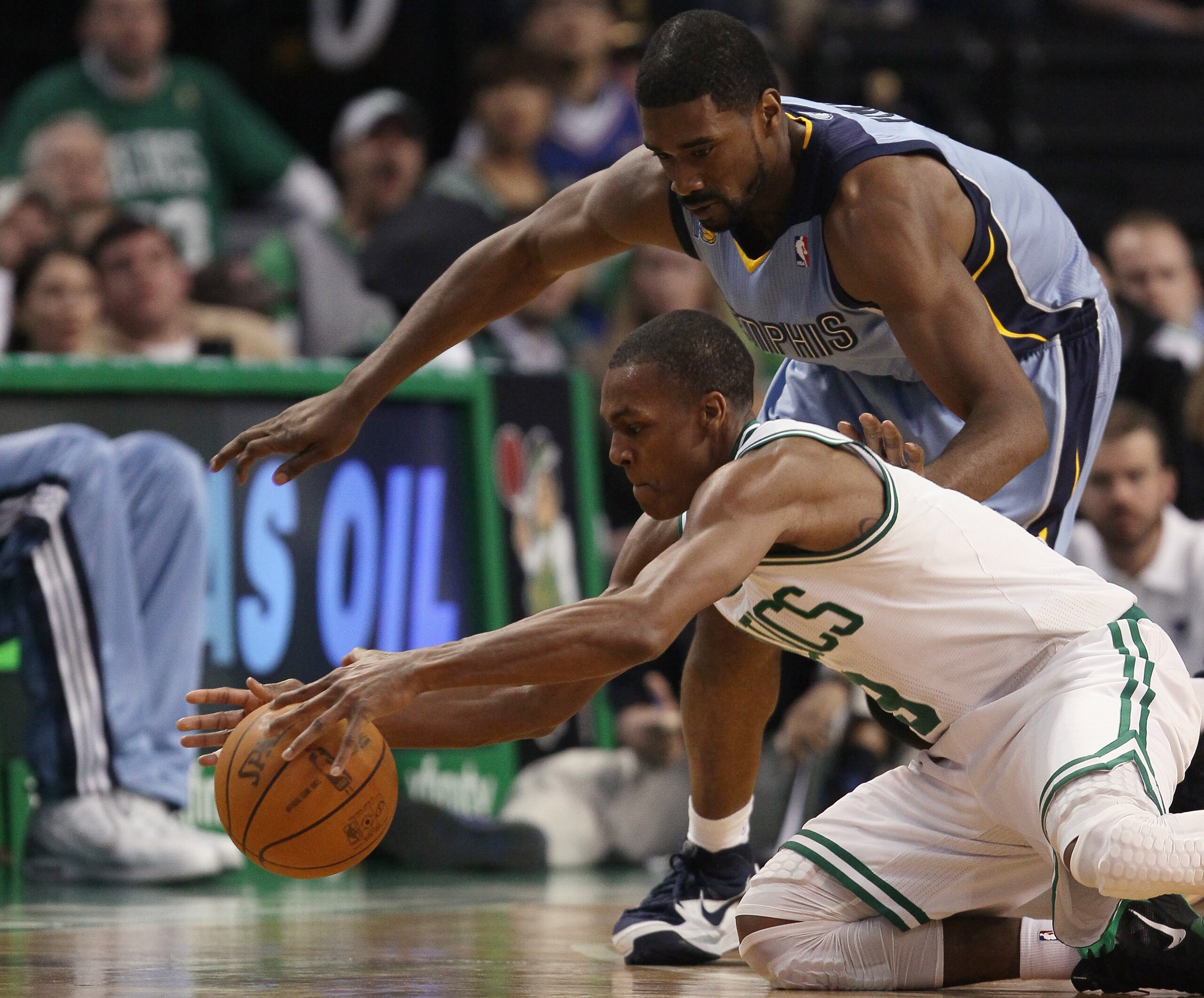 BOSTON, MA - MARCH 23: Rajon Rondo #9 of the Boston Celtics and Leon Powe #7 of the Memphis Grizzlies fight for the ball on March 23, 2011 at the TD Garden in Boston, Massachusetts. The Memphis Grizzlies defeated the Boston Celtics 90-87. NOTE TO USER: BOSTON, MA - MARCH 23: Rajon Rondo #9 of the Boston Celtics and Leon Powe #7 of the Memphis Grizzlies fight for the ball on March 23, 2011 at the TD Garden in Boston, Massachusetts. The Memphis Grizzlies defeated the Boston Celtics 90-87. NOTE TO USER: