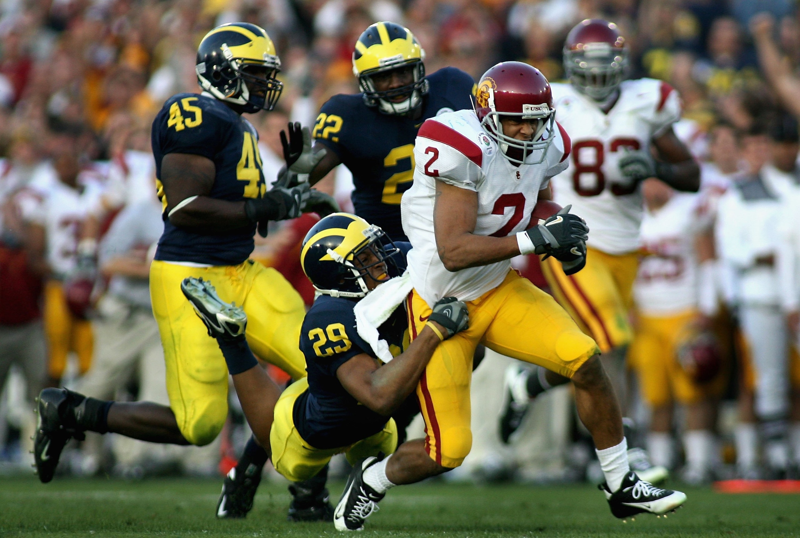 PASADENA, CA - JANUARY 01:  Steve Smith #2 of the USC Trojans runs for a 35 yard completion past Leon Hall #29 of the Michigan Wolverines during the third quarter of the Rose Bowl game on January 1, 2007 at the Rose Bowl in Pasadena, California. The Troja