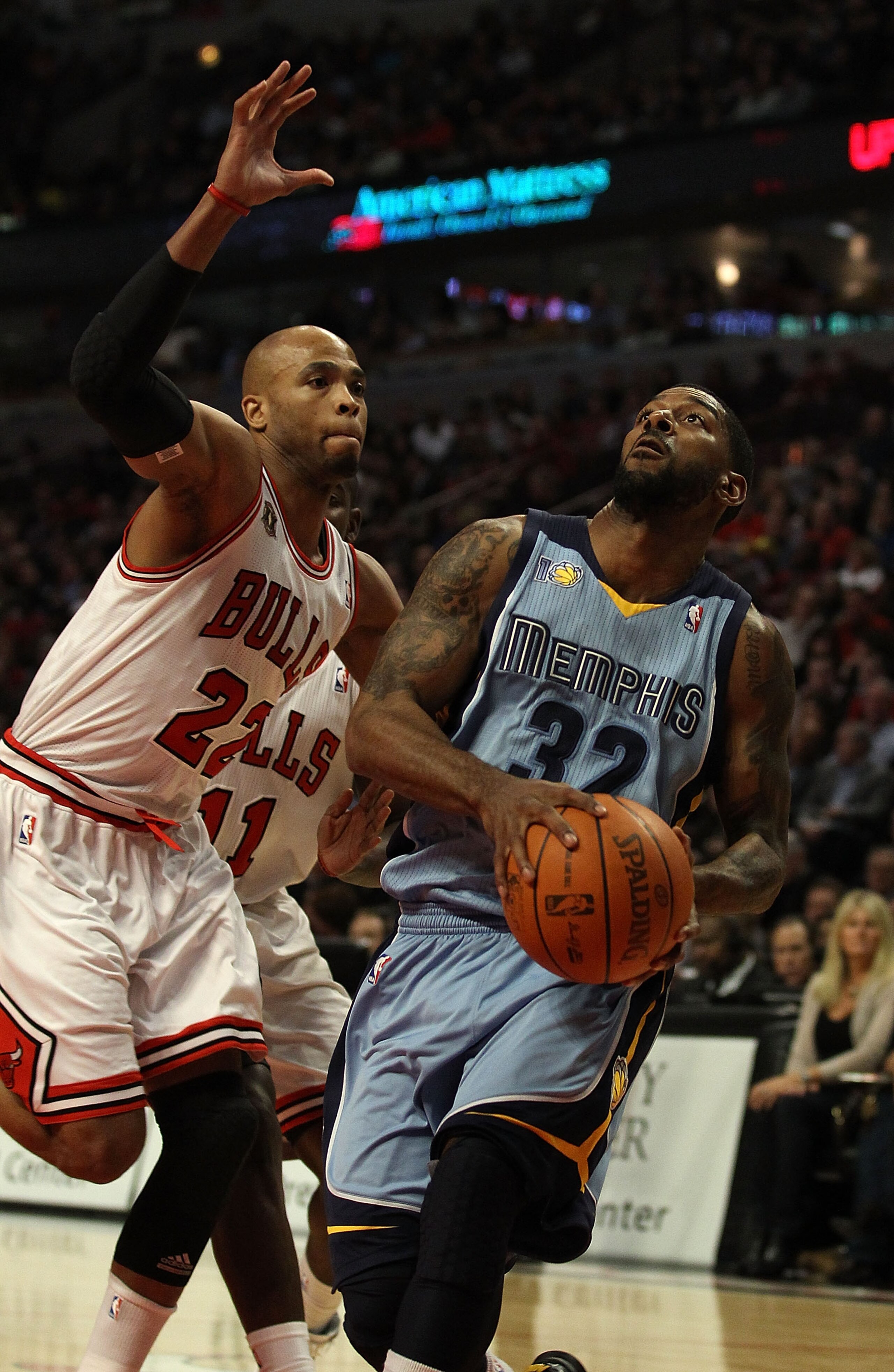 CHICAGO, IL - MARCH 25: O.J. Mayo #32 of the Memphis Grizzlies drives to the basket against Taj Gibson #22 of the Chicago Bulls at the United Center on March 25, 2011 in Chicago, Illinois. The Bulls defeated the Grizzlies 99-96. NOTE TO USER: User express CHICAGO, IL - MARCH 25: O.J. Mayo #32 of the Memphis Grizzlies drives to the basket against Taj Gibson #22 of the Chicago Bulls at the United Center on March 25, 2011 in Chicago, Illinois. The Bulls defeated the Grizzlies 99-96. NOTE TO USER: User express