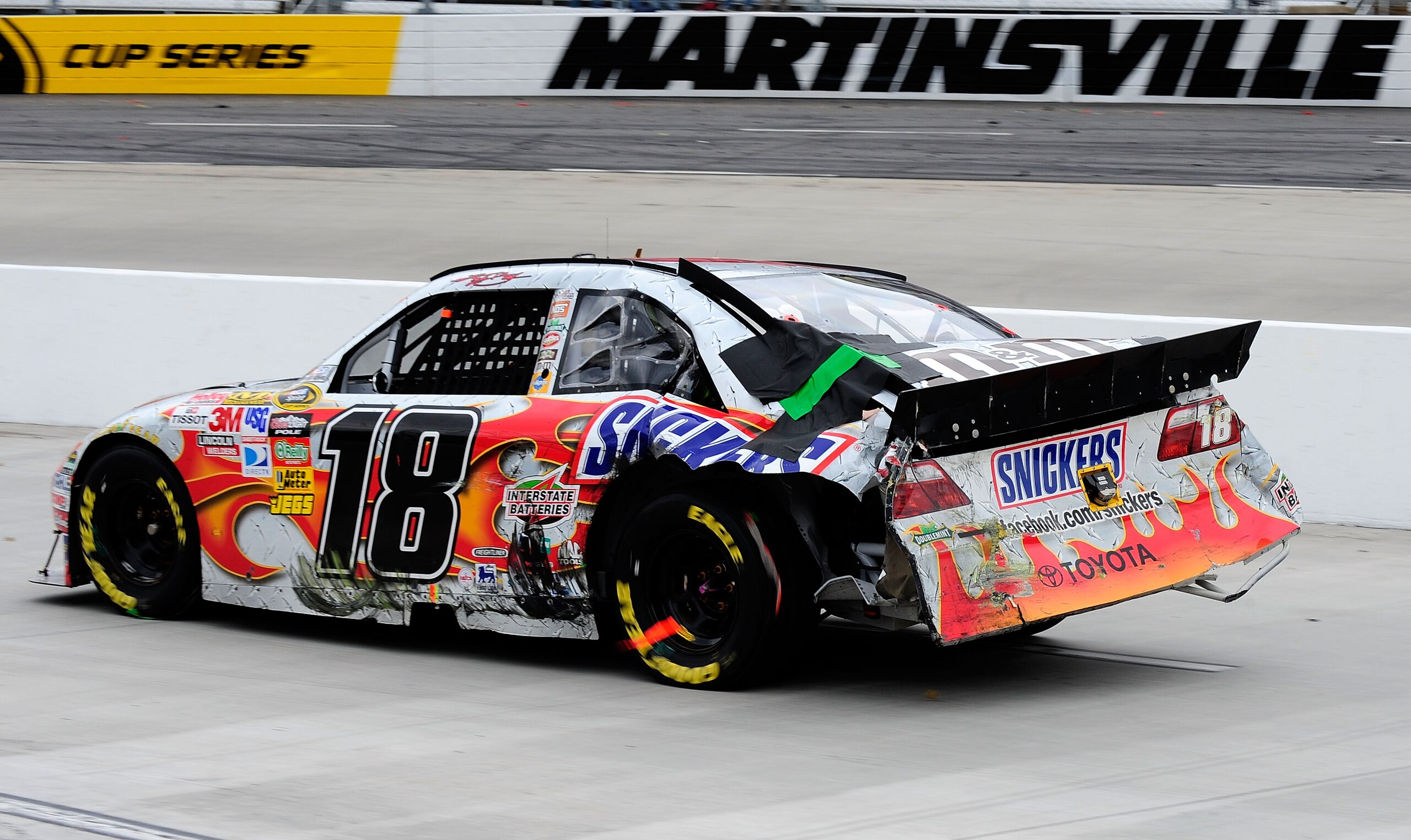 MARTINSVILLE, VA - MARCH 29:  Kyle Busch driver of the #18 Snickers Toyota drives with damage to his car after a crash during the NASCAR Sprint Cup Series Goody's Fast Pain Relief 500 at Martinsville Speedway on March 29, 2010 in Martinsville, Virginia.