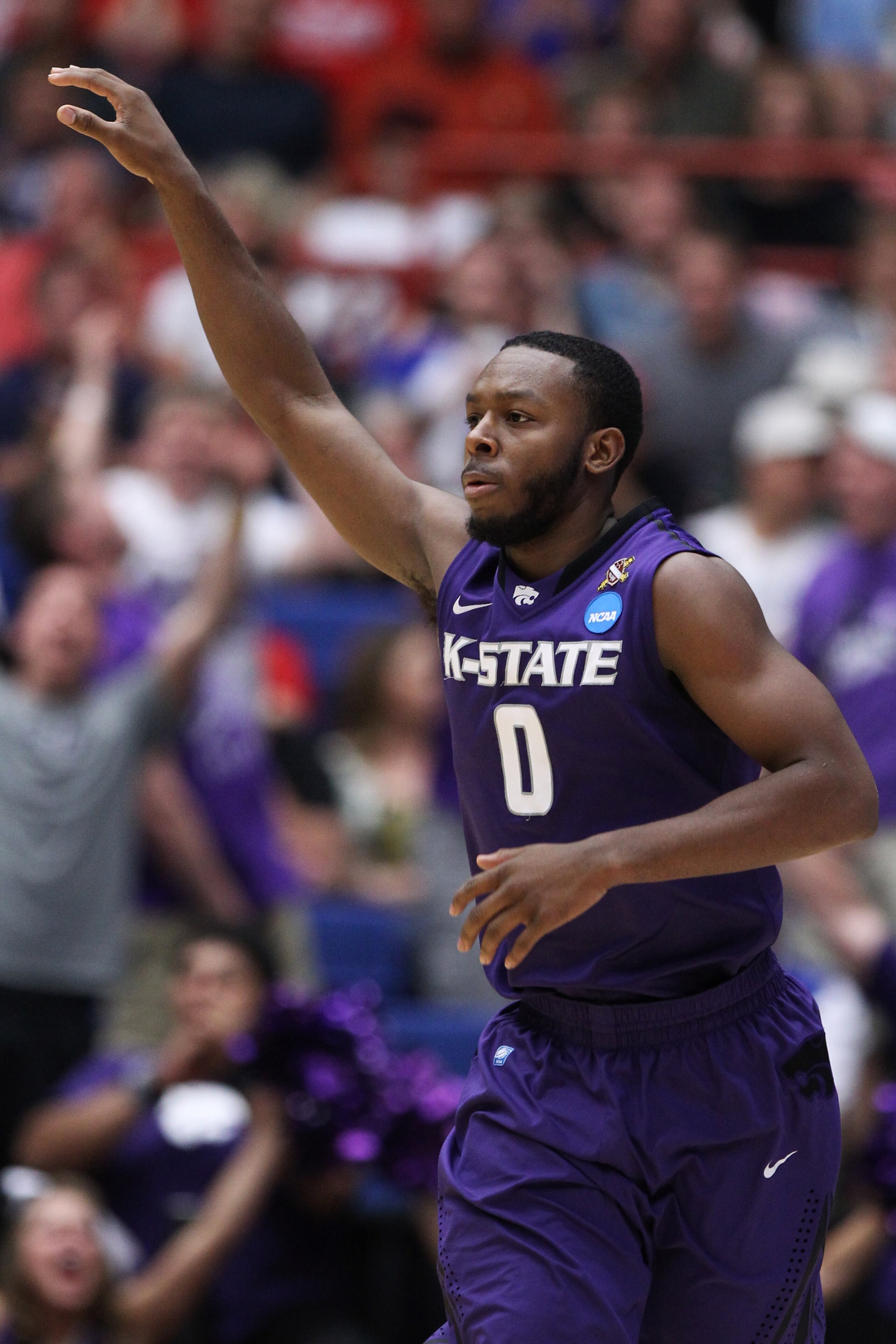 TUCSON, AZ - MARCH 19: Jacob Pullen #0 of the Kansas State Wildcats celebrates during theior game against the Wisconsin Badgers during the third round of the 2011 NCAA men's basketball tournament at McKale Center on March 19, 2011 in Tucson, Arizona. (P TUCSON, AZ - MARCH 19: Jacob Pullen #0 of the Kansas State Wildcats celebrates during theior game against the Wisconsin Badgers during the third round of the 2011 NCAA men's basketball tournament at McKale Center on March 19, 2011 in Tucson, Arizona. (P