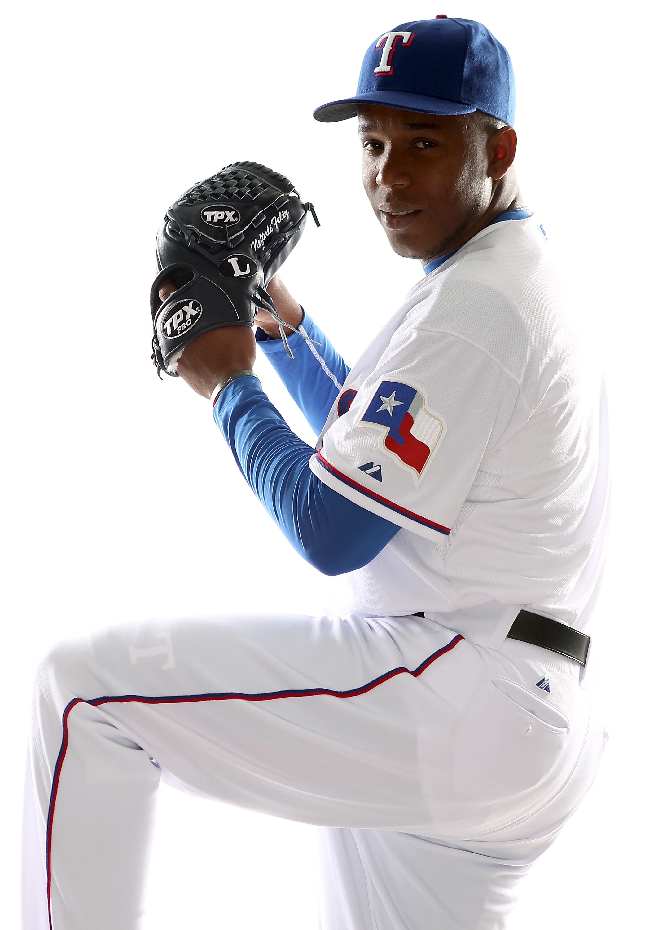 SURPRISE, AZ - FEBRUARY 25:  Neftali Feliz #30 of the Texas Rangers poses for a portrait during Spring Training Media Day on February 25, 2011 at Surprise Stadium in Surprise, Arizona.  (Photo by Jonathan Ferrey/Getty Images)