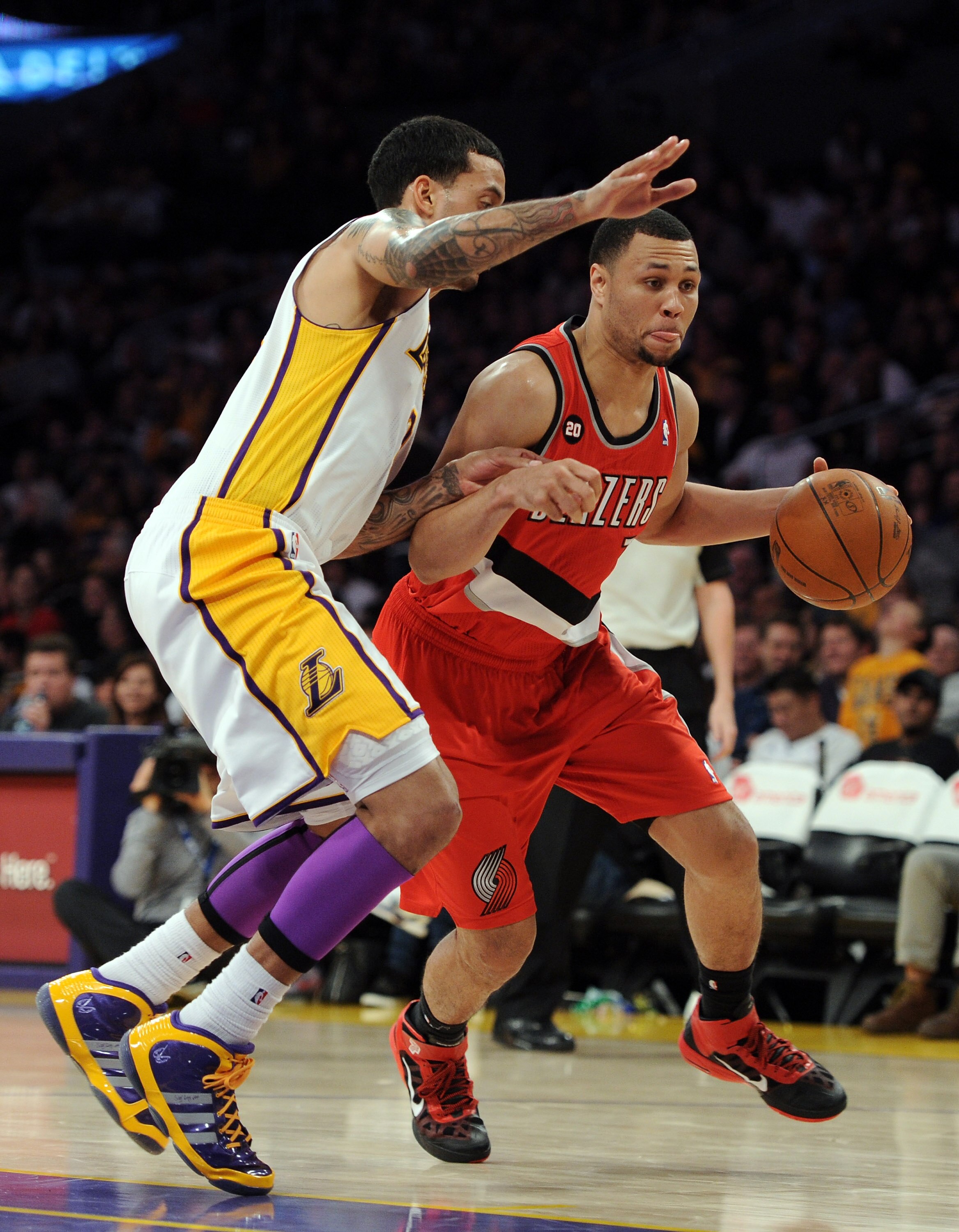 LOS ANGELES, CA - MARCH 20:  Brandon Roy #7 of the Portland Trail Blazers dribbles as he is defended by Matt Barnes #9 of the Los Angeles Lakers at the Staples Center on March 20, 2011 in Los Angeles, California.  NOTE TO USER: User expressly acknowledges