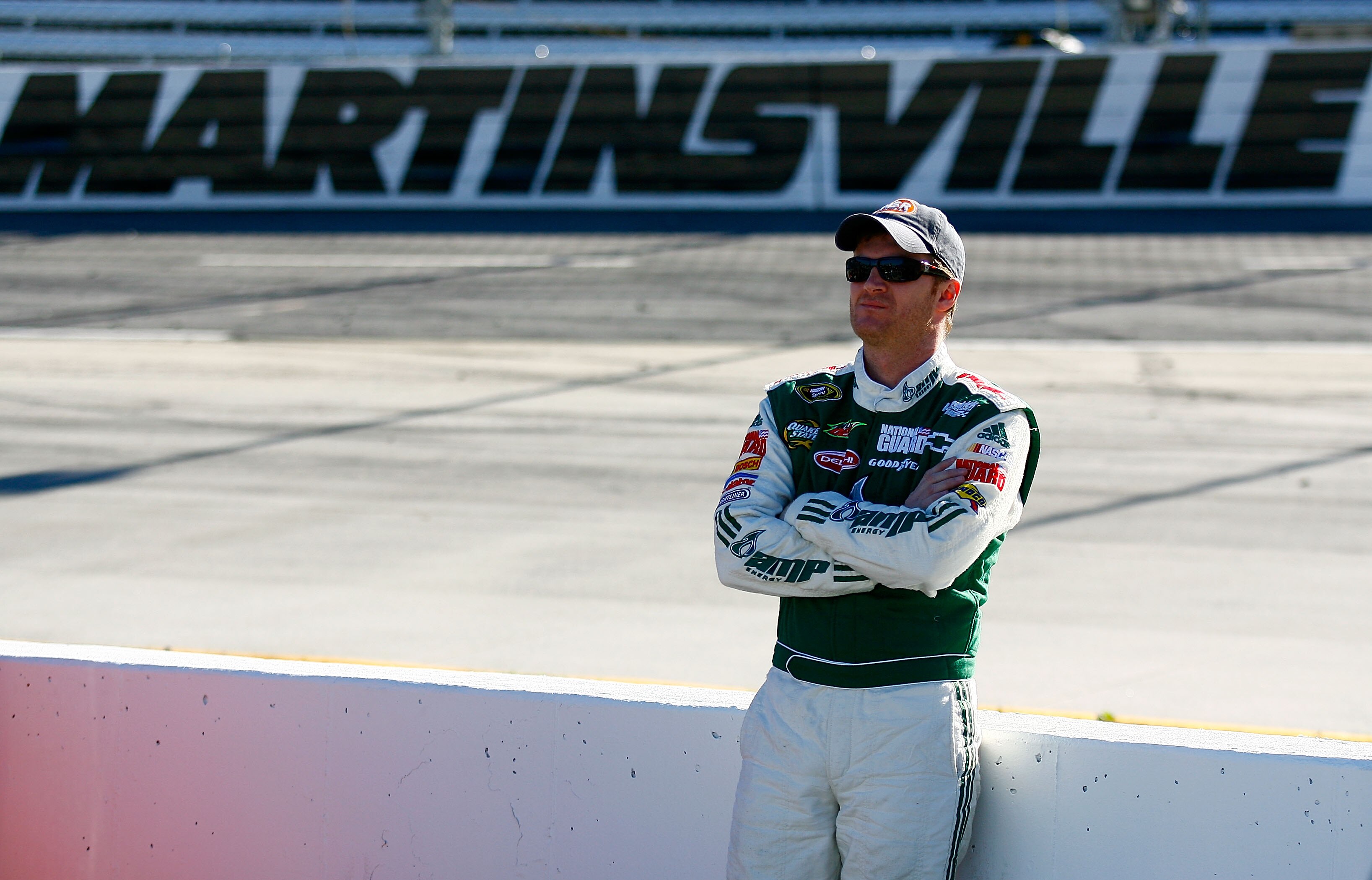 MARTINSVILLE, VA - OCTOBER 22:  Dale Earnhardt Jr., driver of the #88 AMP Energy/National Guard Chevrolet, stands on pit road during qualifying for the NASCAR Sprint Cup Series TUMS Fast Relief 500 at Martinsville Speedway on October 22, 2010 in Martinsvi
