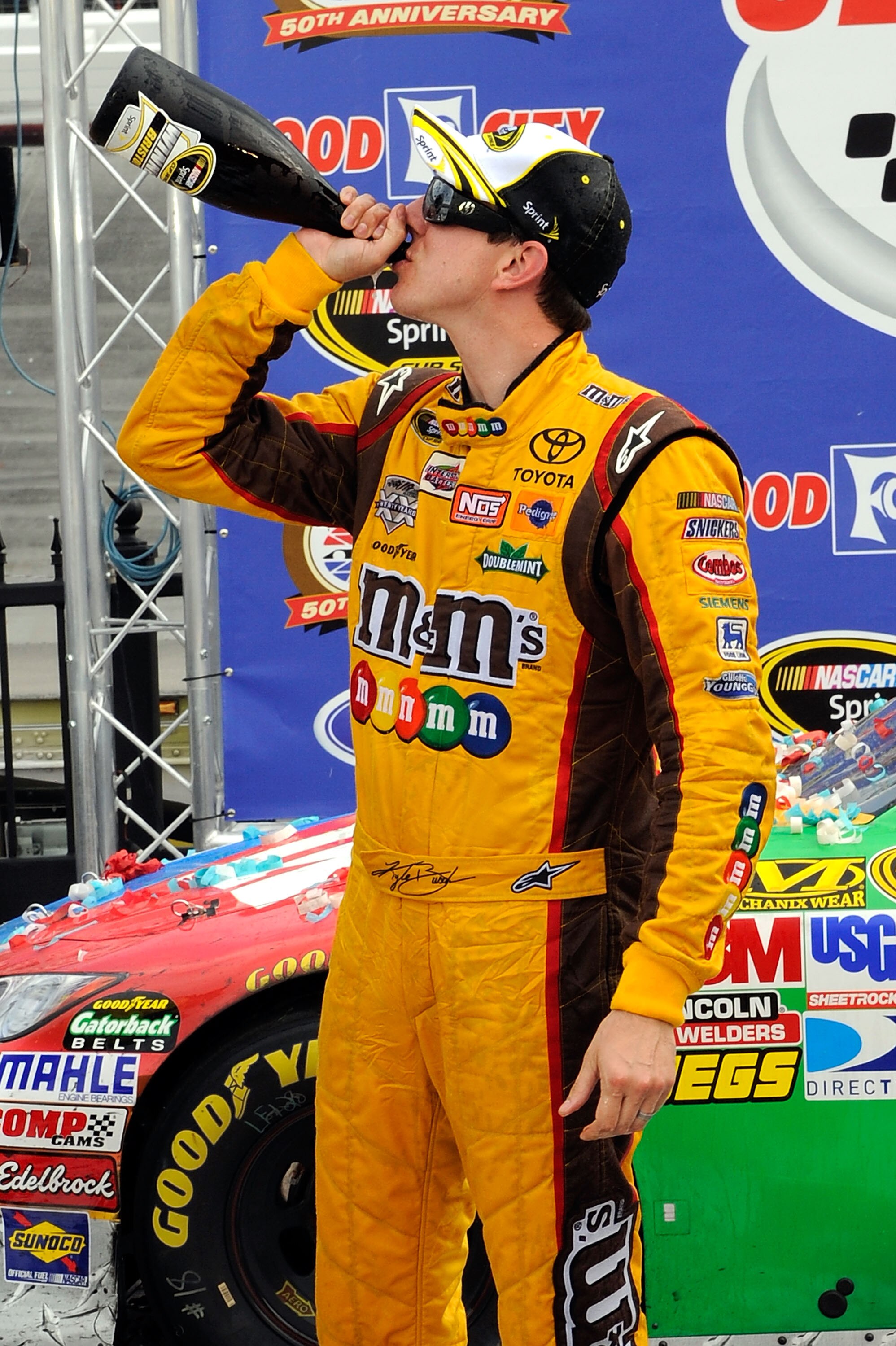 BRISTOL, TN - MARCH 20:  Kyle Busch, driver of the #18 M&M's Toyota, celebrates in Victory Lane after winning the NASCAR Sprint Cup Series Jeff Byrd 500 Presented By Food City at Bristol Motor Speedway on March 20, 2011 in Bristol, Tennessee.  (Photo by J