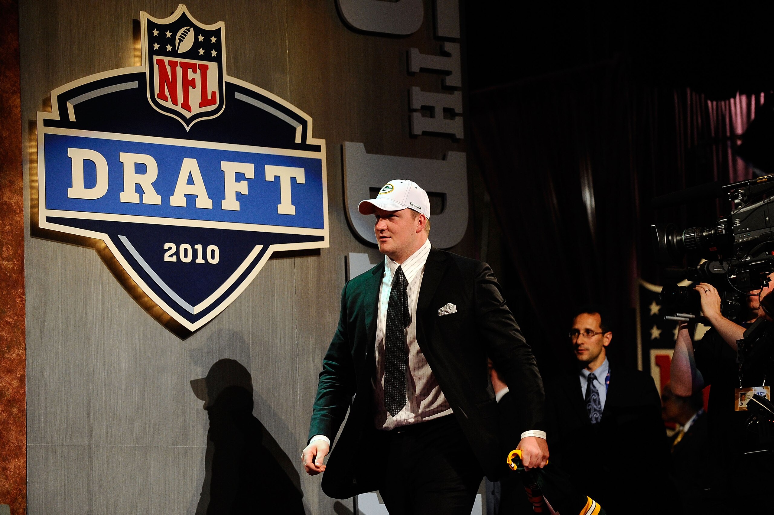 NEW YORK - APRIL 22:  Bryan Bulaga from the Iowa Hawkeyes walks out on stage after the Green Bay Packers drafted him number 23 overall during the first round of the 2010 NFL Draft at Radio City Music Hall on April 22, 2010 in New York City.  (Photo by Jef
