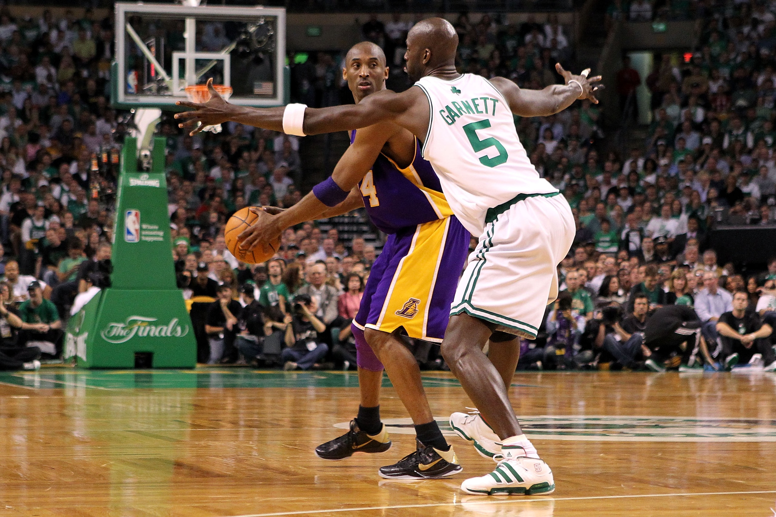 BOSTON - JUNE 08:  Kobe Bryant #24 of the Los Angeles Lakers looks to pass over Kevin Garnett #5 of the Boston Celtics in Game Three of the 2010 NBA Finals on June 8, 2010 at TD Garden in Boston, Massachusetts. NOTE TO USER: User expressly acknowledges an