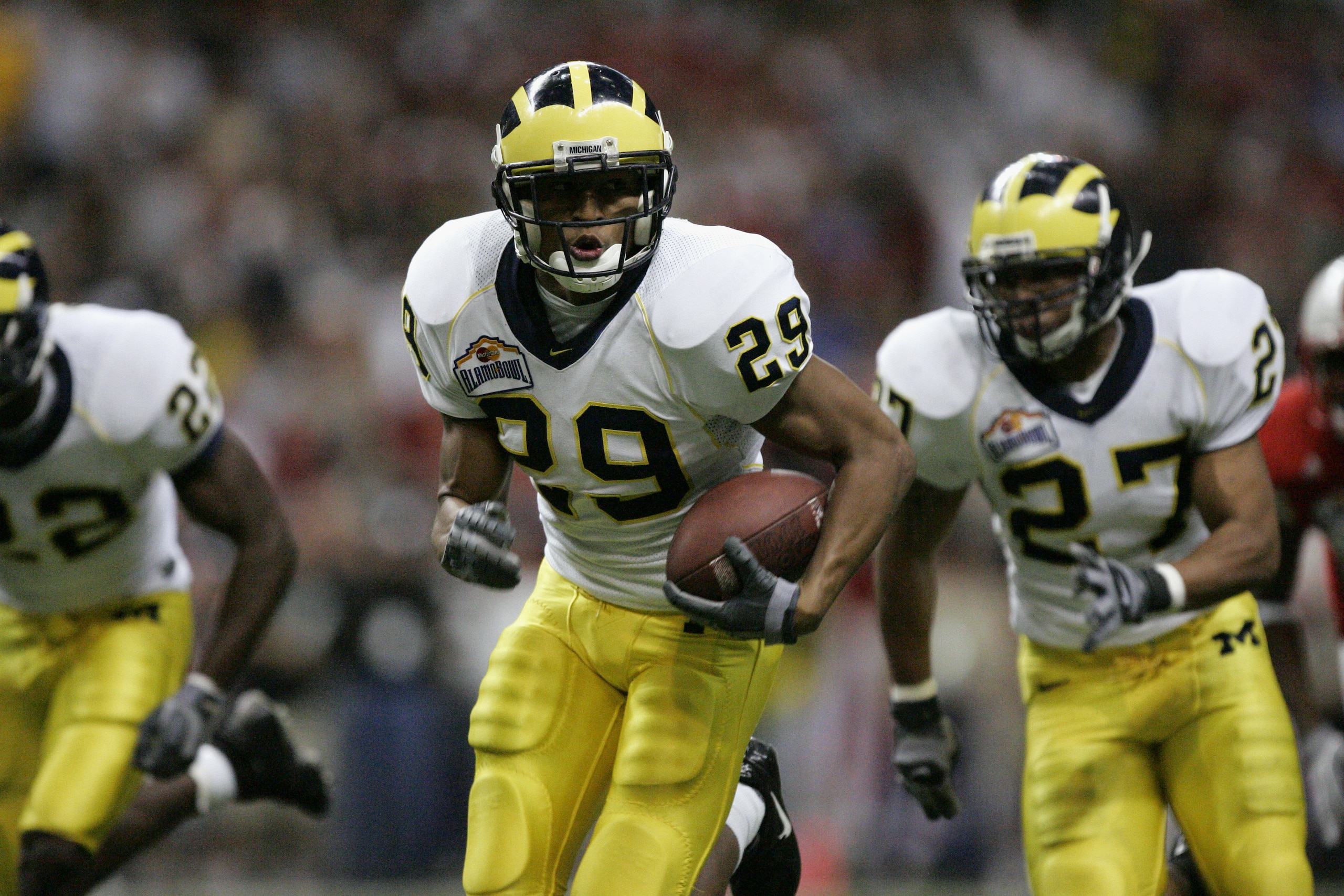 SAN ANTONIO - DECEMBER 28:  Cornerback Leon Hall #29 of the Michigan Wolverines returns an interception against the Nebraska Cornhuskers during the MasterCard Alamo Bowl on December 28, 2005 at the Alamodome in San Antonio, Texas.  The Huskers won 32-28.