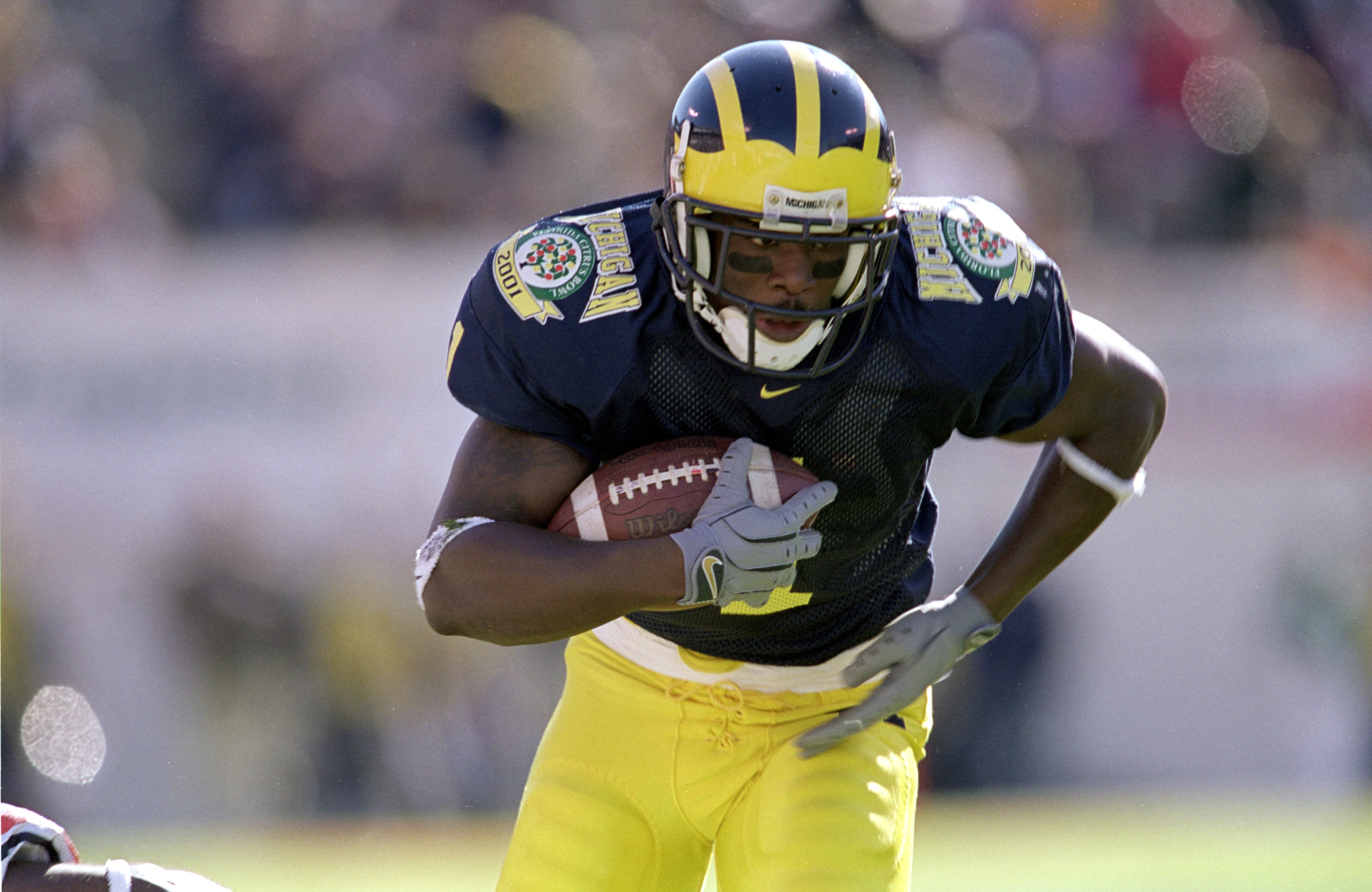 1 Jan 2001:  David Terrell #1 of the Michigan Wolverines moves with the ball during the Citrus Bowl Game against the Auburn Tigers at the Citrus Bowl in Orlando, Florida.  The Wolverines defeated the Tiger 31-28.Mandatory Credit: Andy Lyons  /Allsport