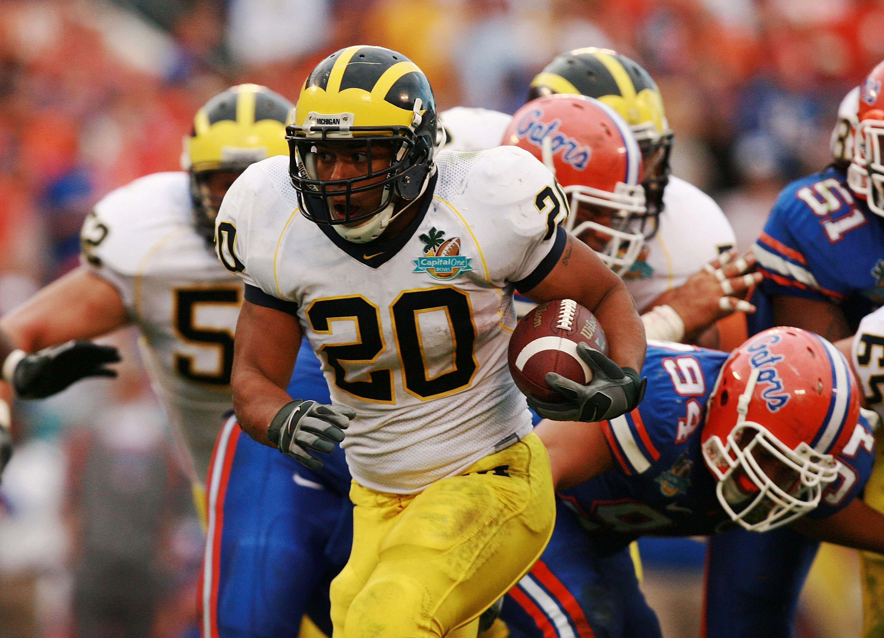 ORLANDO, FL - JANUARY 01:  Running back Mike Hart #20 of the Michigan Wolverines looks for room to run while taking on the Florida Gators in the Capital One Bowl at Florida Citrus Bowl on January 1, 2008 in Orlando, Florida. Michigan defeated Florida 41-3