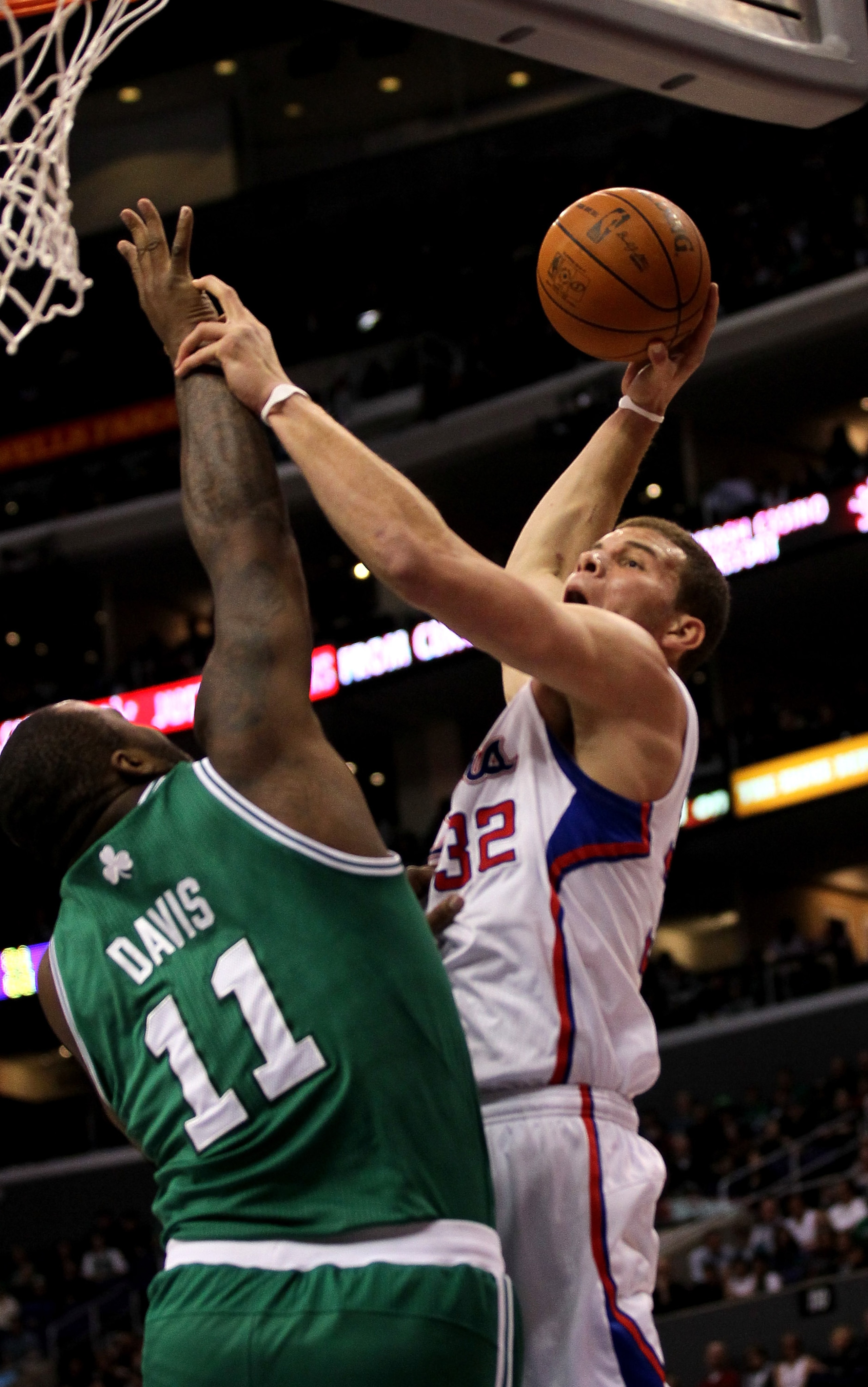 LOS ANGELES, CA - FEBRUARY 26:  Blake Griffin #32 of the Los Angeles Clippers goes for a dunk over Glen Davis #11 of the Boston Celtics at Staples Center on February 26, 2011  in Los Angeles, California. The Celtics won 99-92.  NOTE TO USER: User expressl