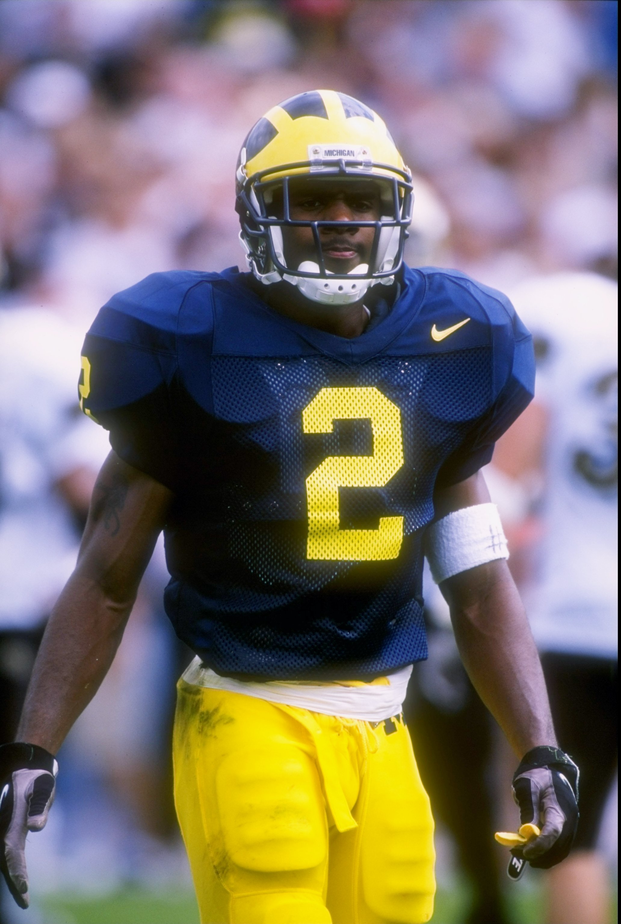 13 Sep 1997: Cornerback Charles Woodson of the Michigan Wolverines stands on the field during a game against the Colorado Buffaloes at Michigan Stadium in Ann Arbor, Michigan. Michigan won the game 27-3.