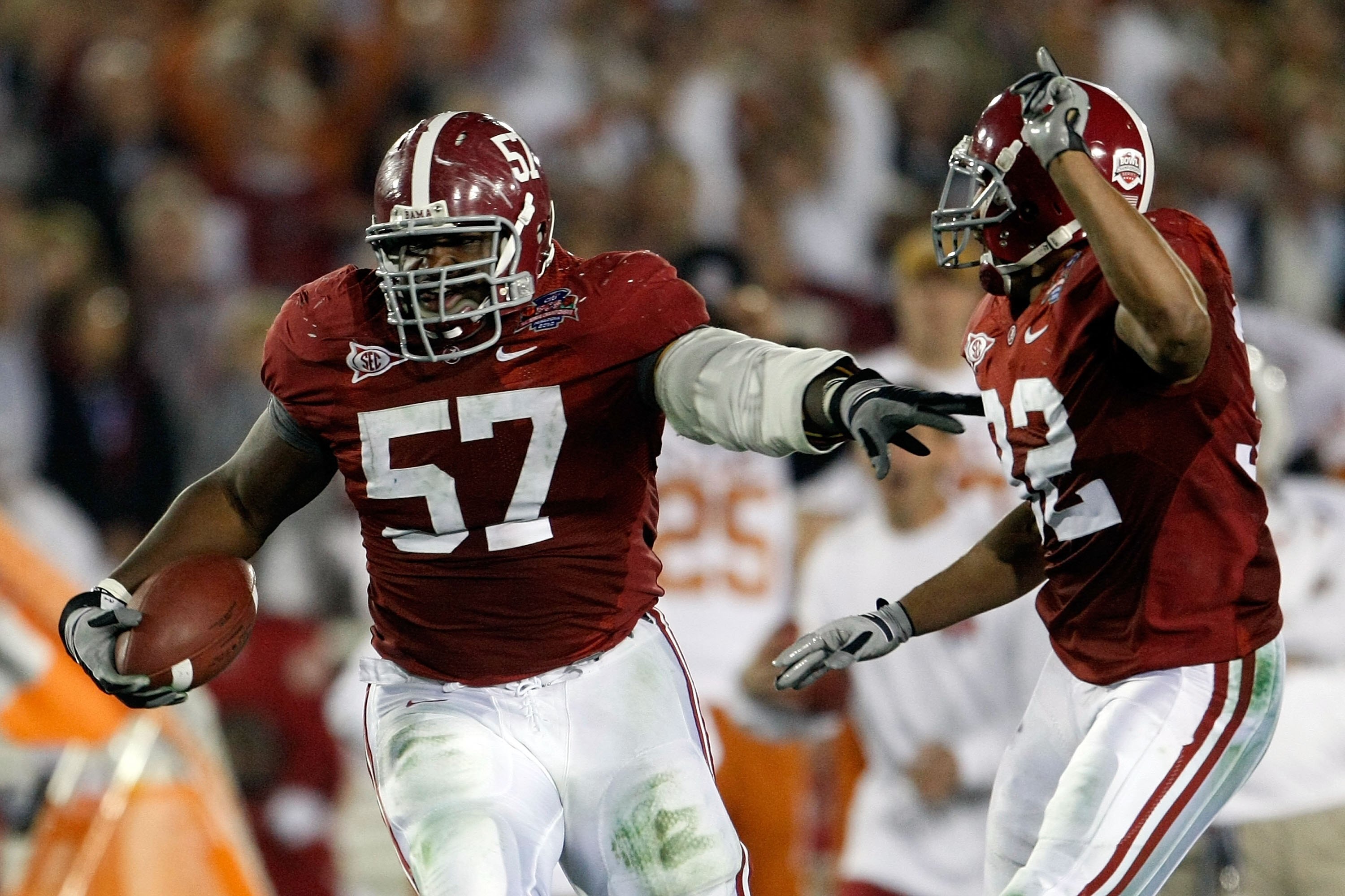 PASADENA, CA - JANUARY 07:  Lineman Marcell Dareus #57 of the Alabama Crimson Tide runs with the ball after an interception against the Texas Longhorns during the second quarter of the Citi BCS National Championship game at the Rose Bowl on January 7, 201