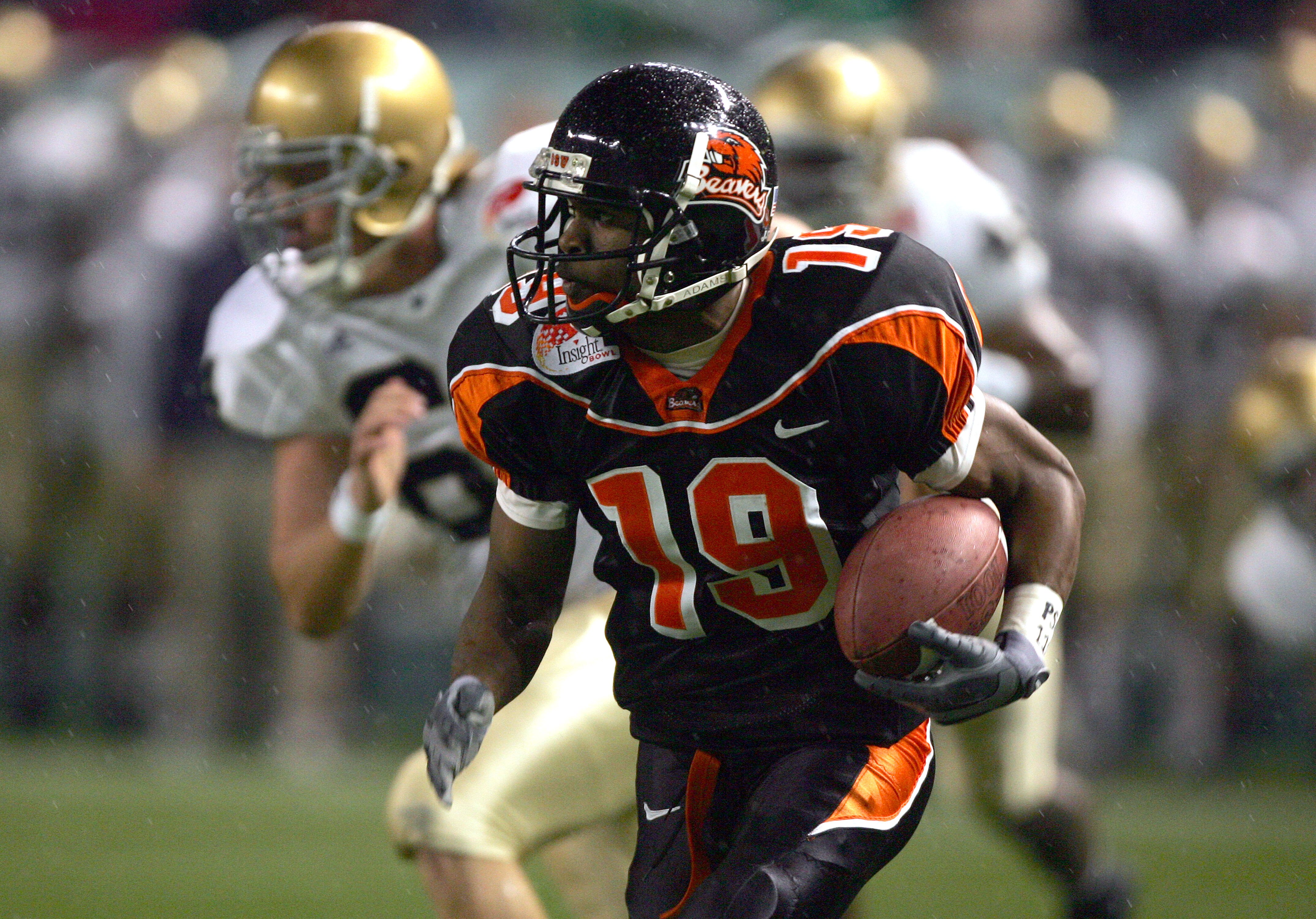 PHOENIX - DECEMBER 28:  Wide receiver Sammie Stroughter #19 of the Oregon State Beavers runs upfield against the Notre Dame Fighting Irish in the Insight Bowl at Bank One Ballpark on December 28, 2004 in Phoenix, Arizona.  Oregon State defeated Notre Dame