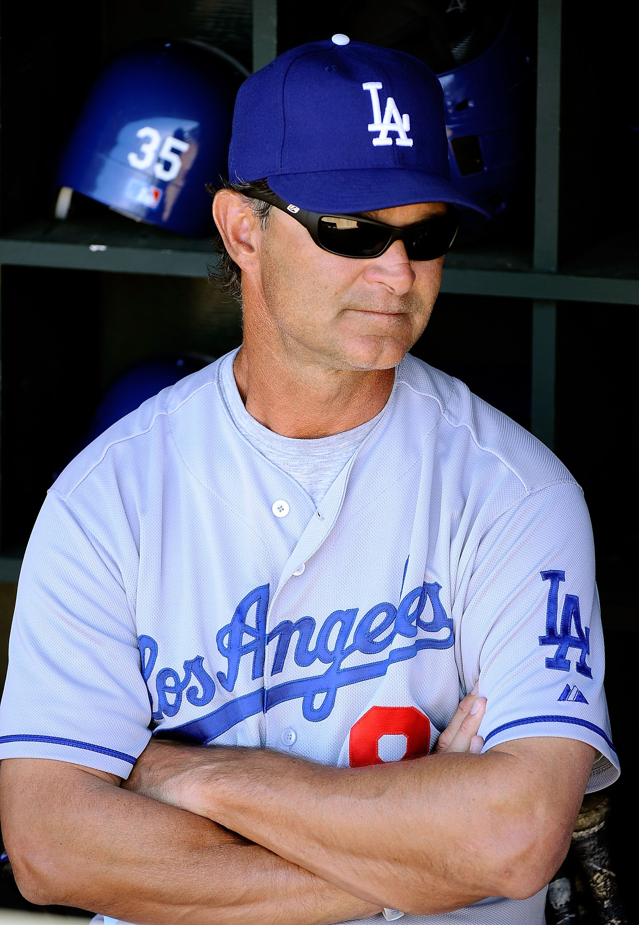 SURPRISE, AZ - MARCH 12:  Manager Don Mattingly of Los Angeles Dodgers sits in the dug out during the spring training baseball game against the Kansas City Royals at Surprise Stadium on March 12, 2011 in Surprise, Arizona.  (Photo by Kevork Djansezian/Get