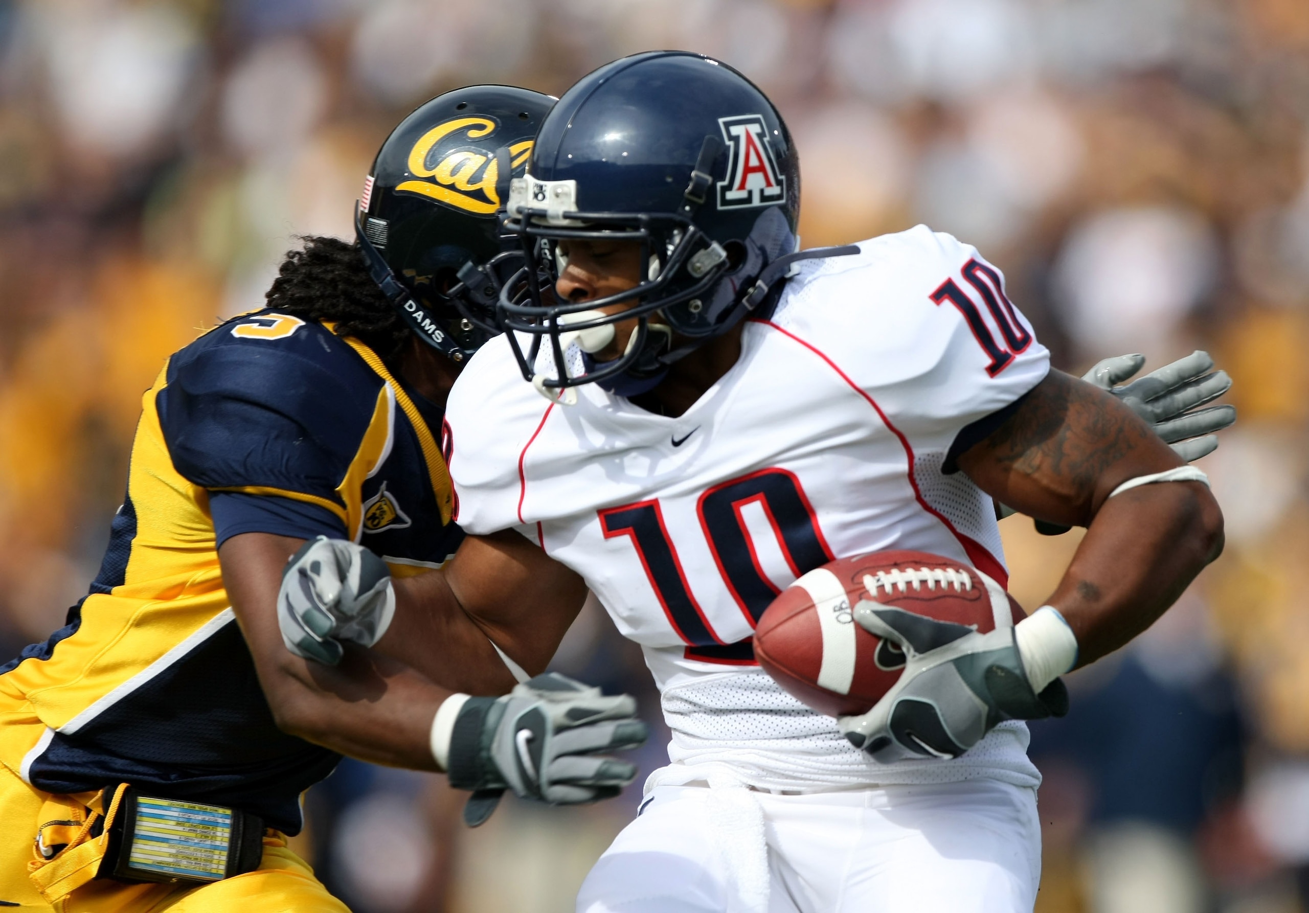 BERKELEY, CA - SEPTEMBER 22:  Mike Thomas #10 of the Arizona Wildcats runs against Syd'Quan Thompson #5 of the California Golden Bears during an NCAA football game at Memorial Stadium September 22, 2007 in Berkeley, California.  (Photo by Jed Jacobsohn/Ge