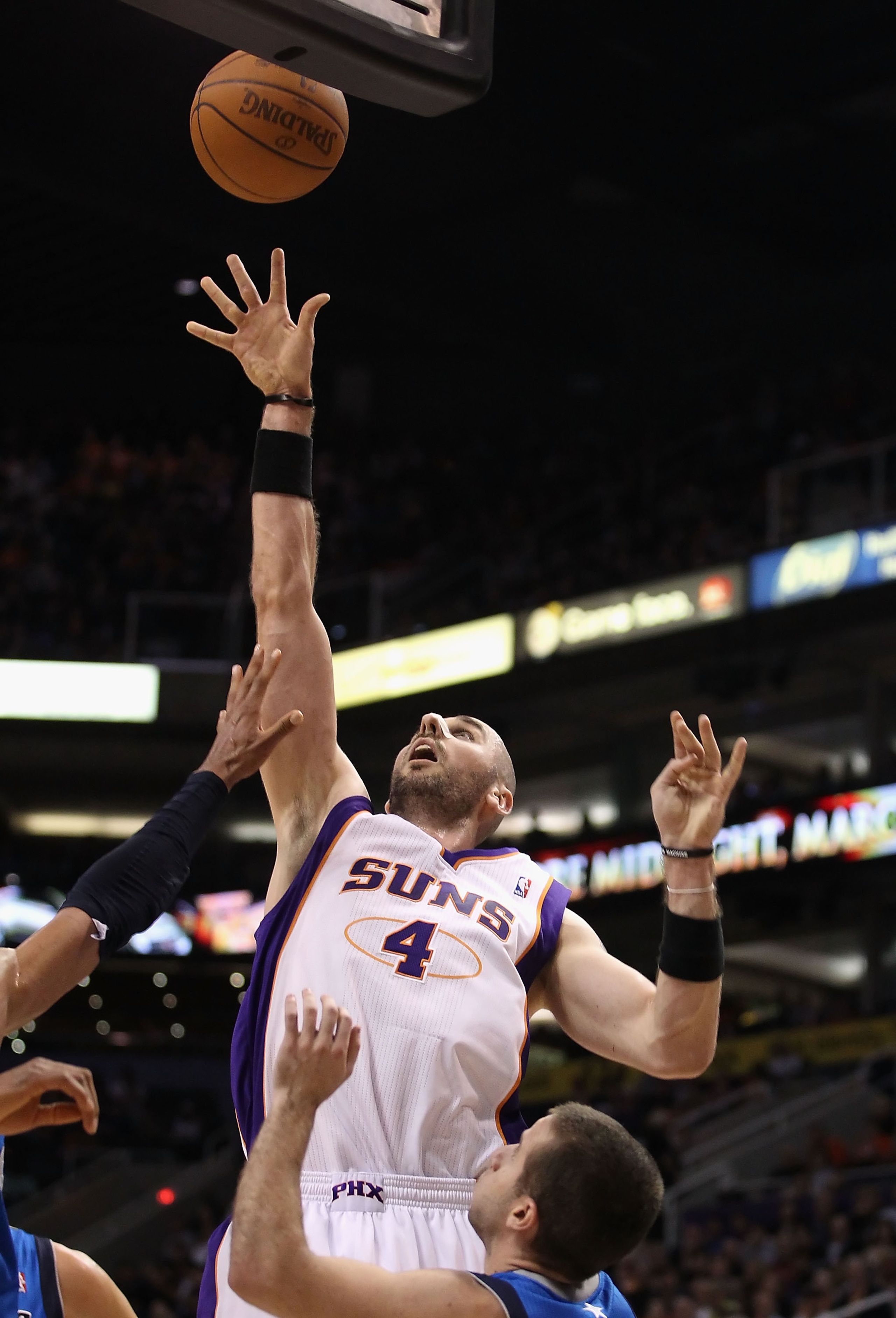 PHOENIX, AZ - MARCH 27:  Marcin Gortat #4 of the Phoenix Suns puts up a shot against the Dallas Mavericks during the NBA game at US Airways Center on March 27, 2011 in Phoenix, Arizona. The Mavericks defeated the Suns 91-83. NOTE TO USER: User expressly a