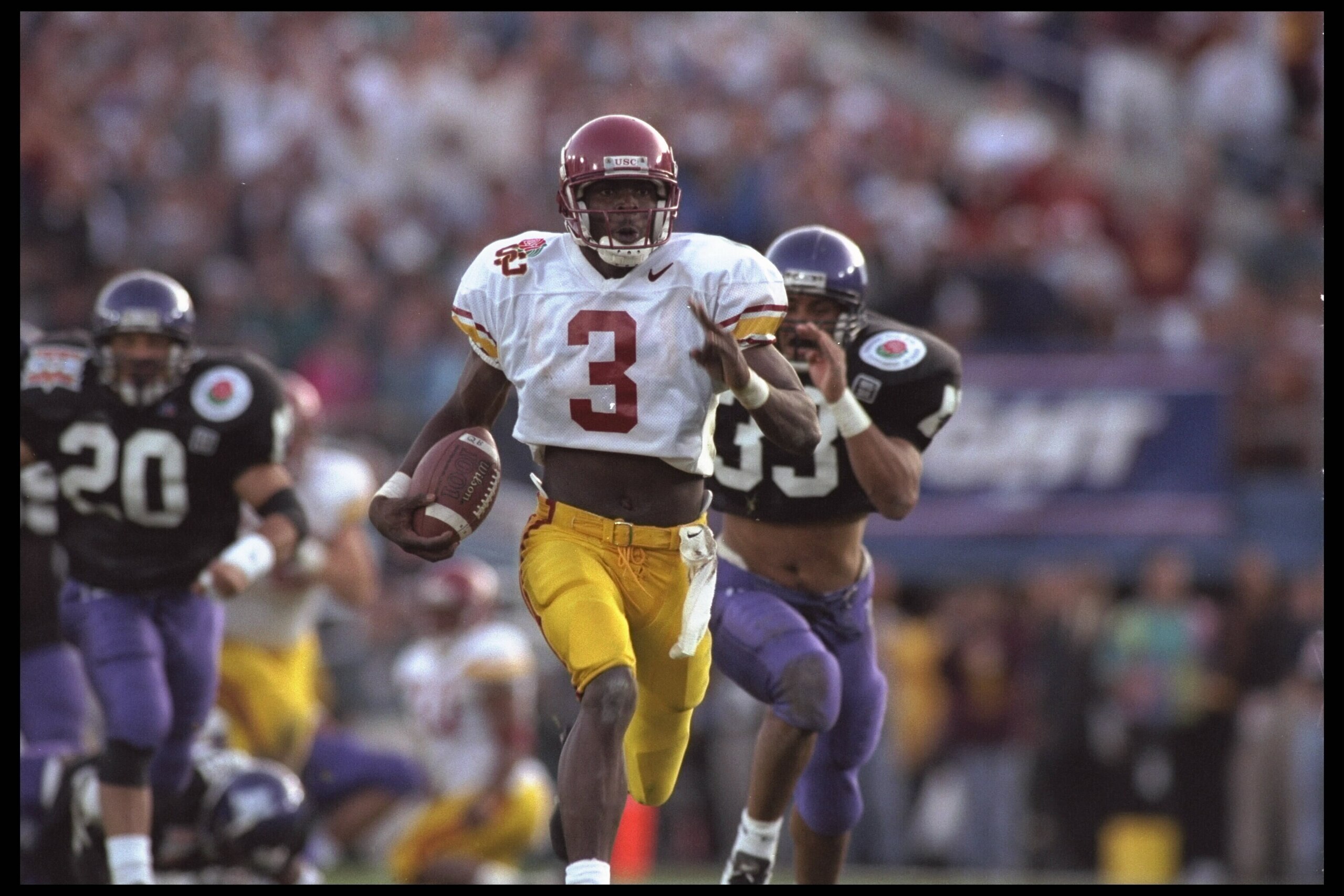 1 Jan 1996:  Wide receiver Keyshawn Johnson #3 of the University of Southern California Trojans carries his reception far downfield in front of some Northwestern Wildcat chasers including free safety William Bennett #20 and strong safety Eric Collier #33.