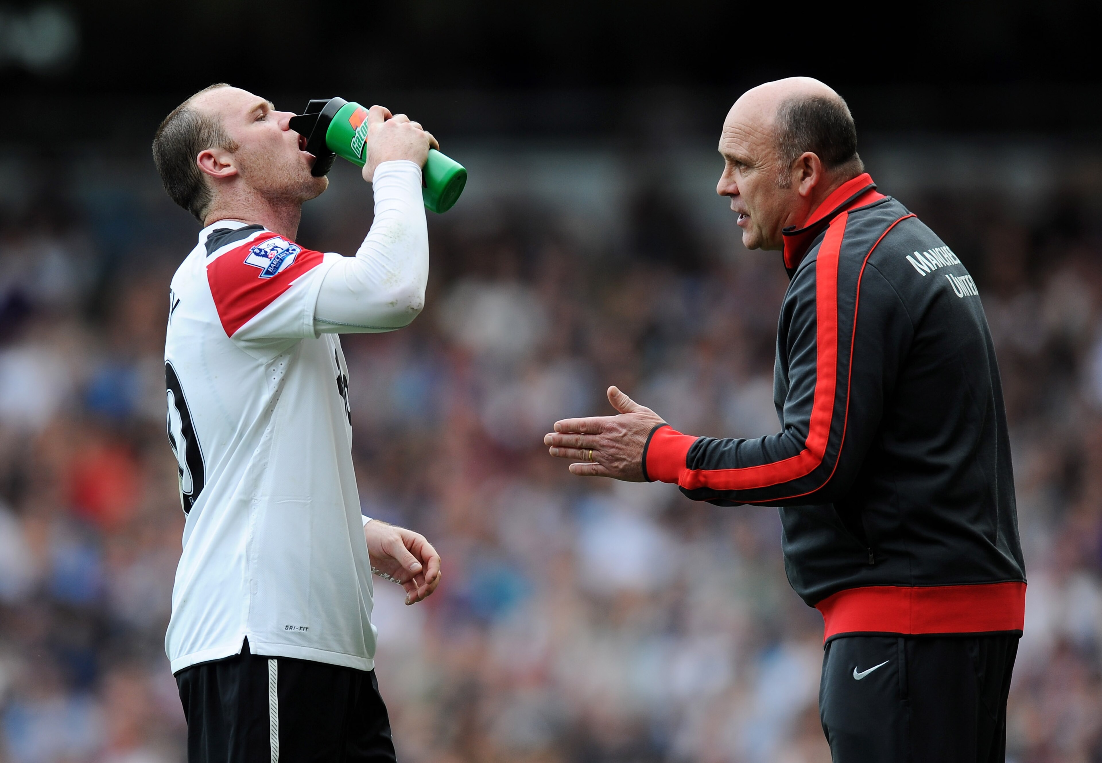 LONDON, ENGLAND - APRIL 02: Manchester United assistant Mike Phelan talks to Wayne Rooney during the Barclays Premier League match between West Ham United and Manchester United at the Boleyn Ground on April 2, 2011 in London, England. (Photo by Mike Hew LONDON, ENGLAND - APRIL 02: Manchester United assistant Mike Phelan talks to Wayne Rooney during the Barclays Premier League match between West Ham United and Manchester United at the Boleyn Ground on April 2, 2011 in London, England. (Photo by Mike Hew