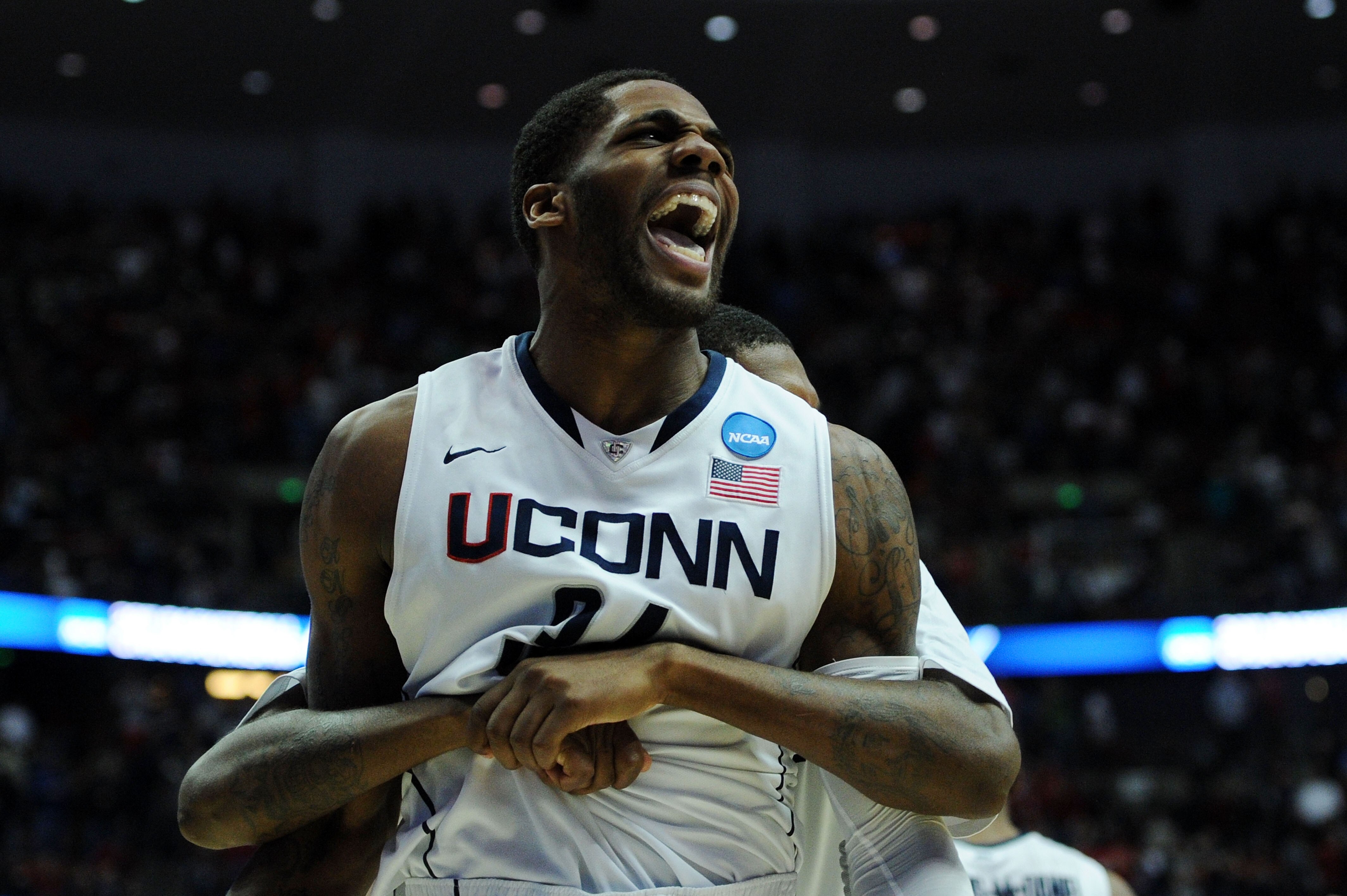 ANAHEIM, CA - MARCH 26:  Alex Oriakhi #34 of the Connecticut Huskies celebrates after defeating the Arizona Wildcats to win the west regional final of the 2011 NCAA men's basketball tournament at the Honda Center on March 26, 2011 in Anaheim, California.
