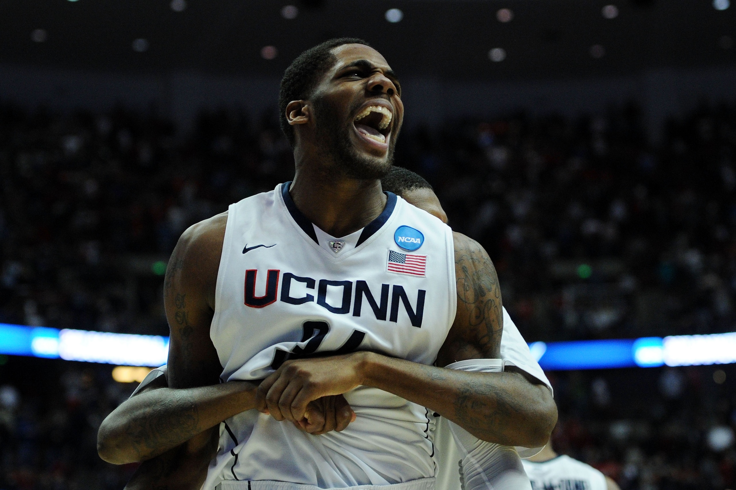 ANAHEIM, CA - MARCH 26:  Alex Oriakhi #34 of the Connecticut Huskies celebrates after defeating the Arizona Wildcats to win the west regional final of the 2011 NCAA men's basketball tournament at the Honda Center on March 26, 2011 in Anaheim, California.