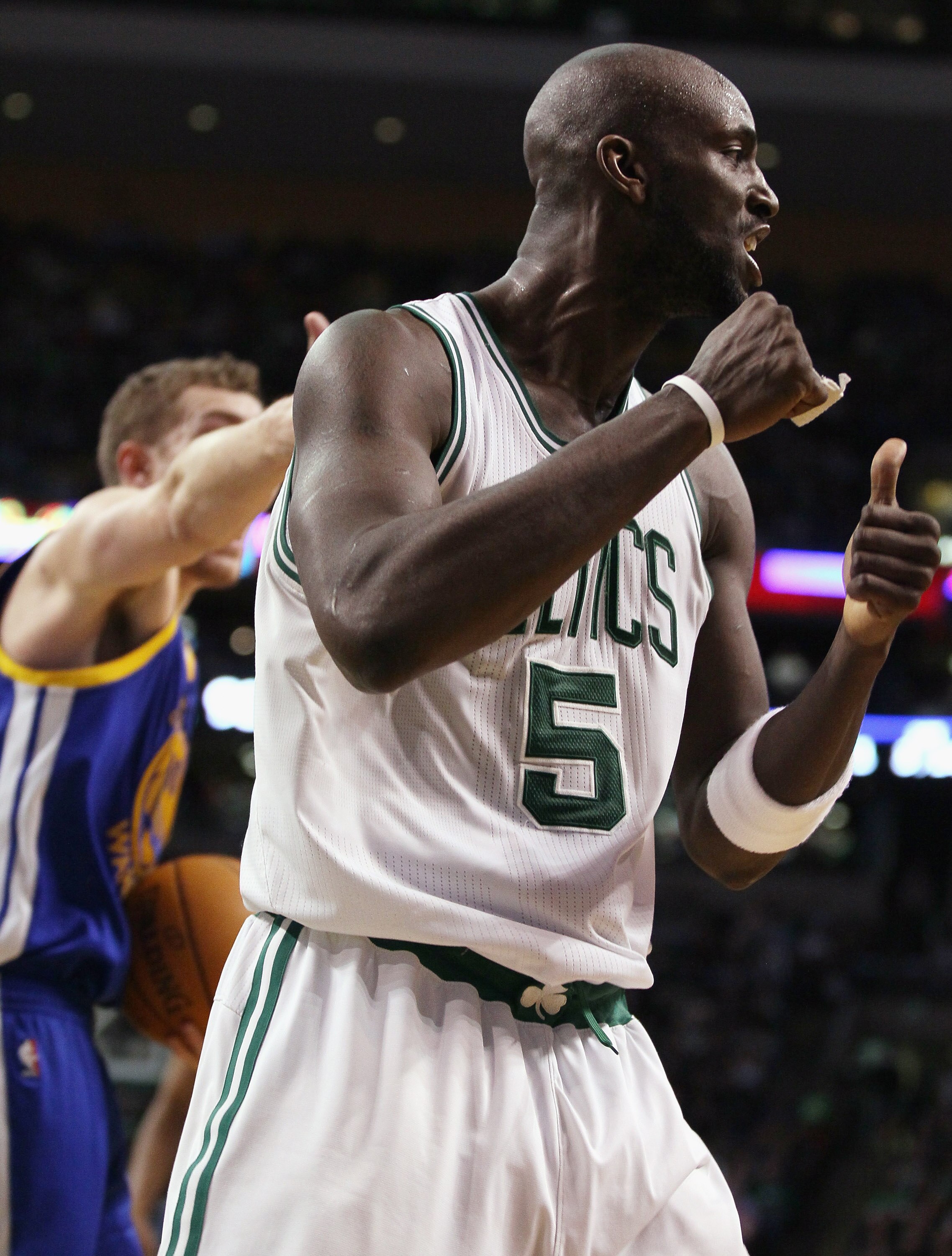 BOSTON, MA - MARCH 04:  Kevin Garnett #5 of the Boston Celtics celebrates the jump ball in the fourth quarter against the Golden State Warriors on March 4, 2011 at the TD Garden in Boston, Massachusetts.  The Celtics defeated the Warriors 107-103. NOTE TO
