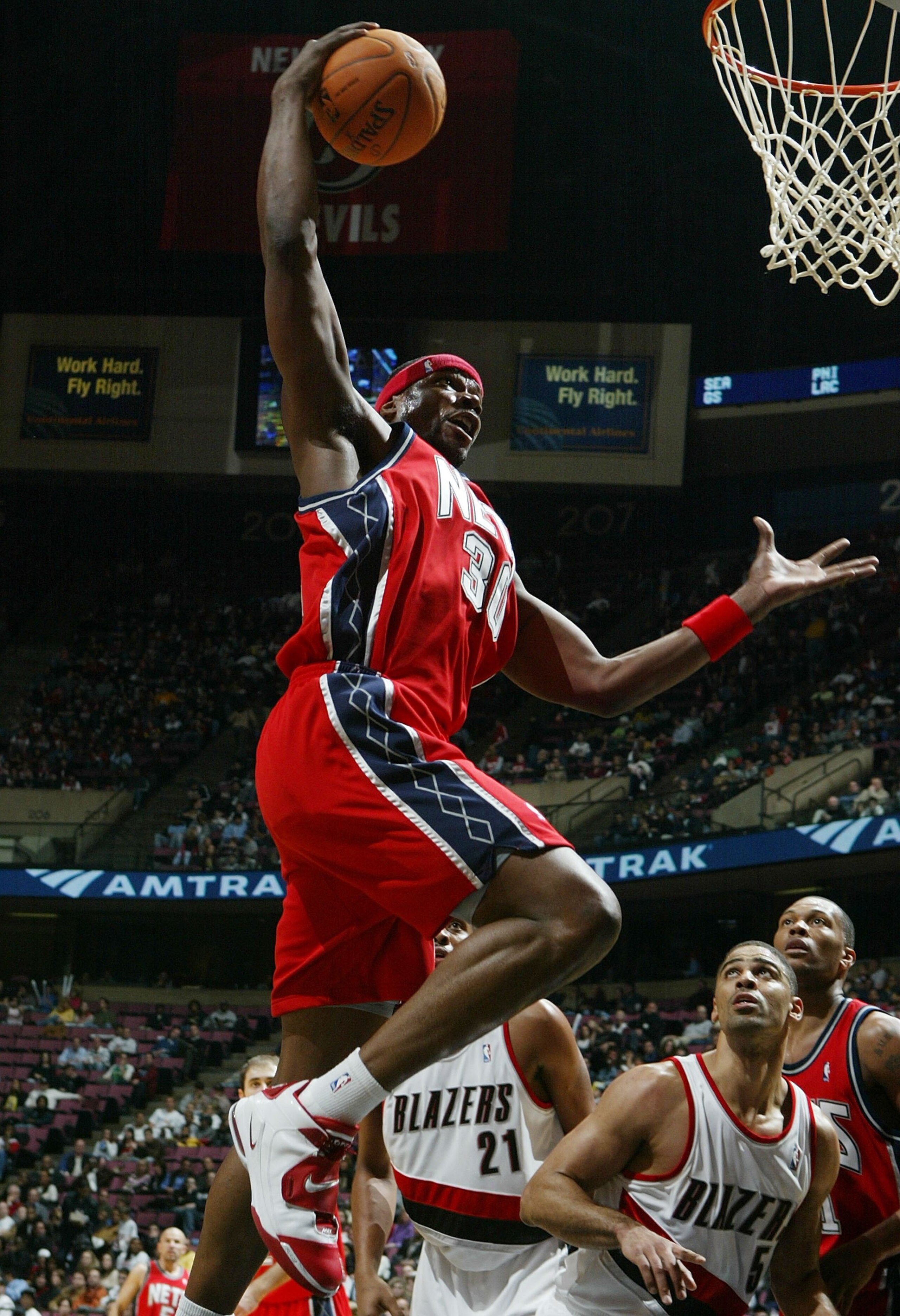 EAST RUTHERFORD, NJ - NOVEMBER 18: Clifford Robinson #30 of the New Jersey Nets grabs a rebound against the Portland Trail Blazers during their game on November 18, 2006 at Continental Airlines Arena in East Rutherford, New Jersey. NOTE TO USER: User expr