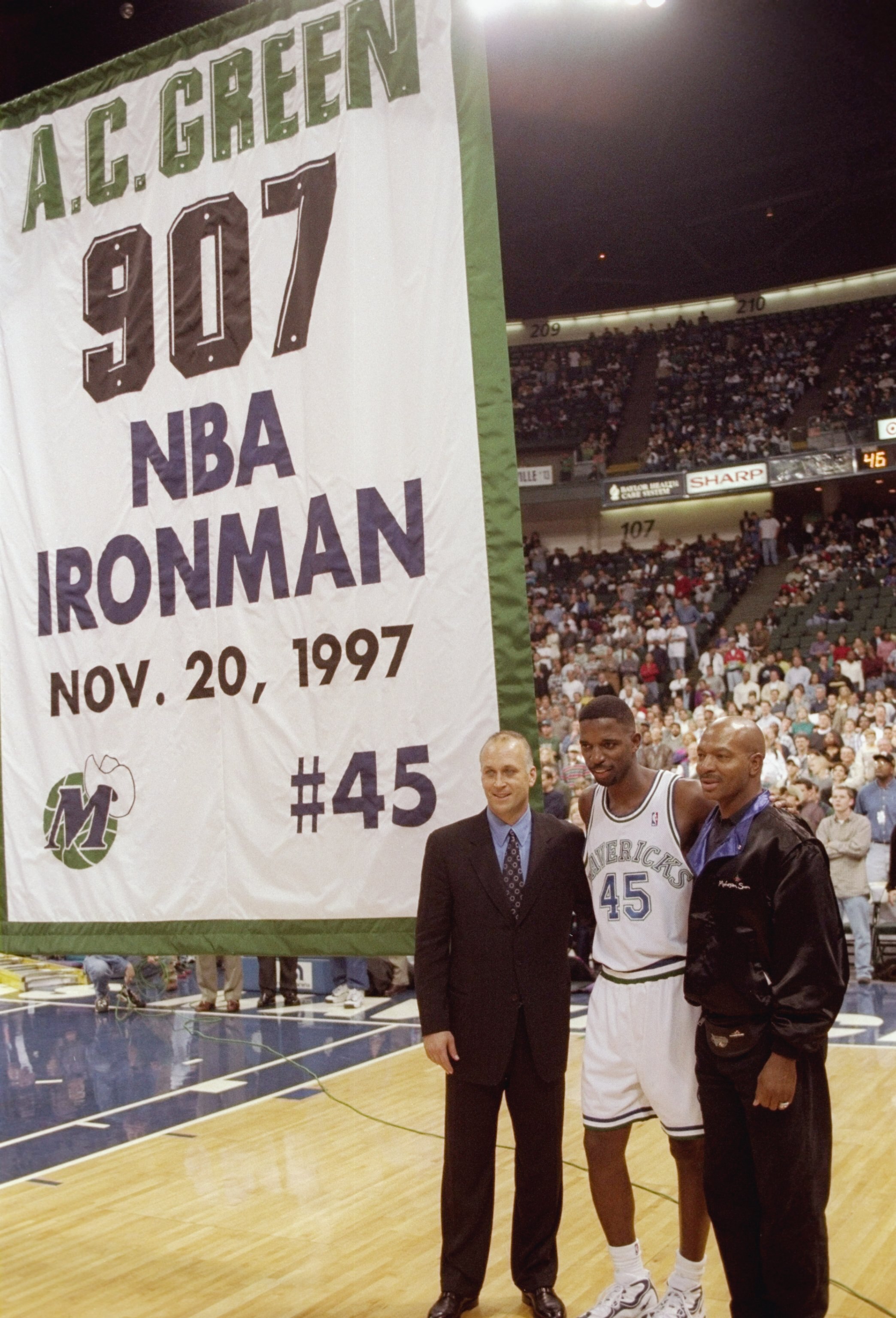 20 Nov 1997:  Forward A. C. Green of the Dallas Mavericks stands between Cal Ripken Jr. (left) and Randy Smith during a break in a game against the Golden State Warriors at the Reunion Arena in Dallas, Texas.  The Warrors won the game 101-97.  Green set t