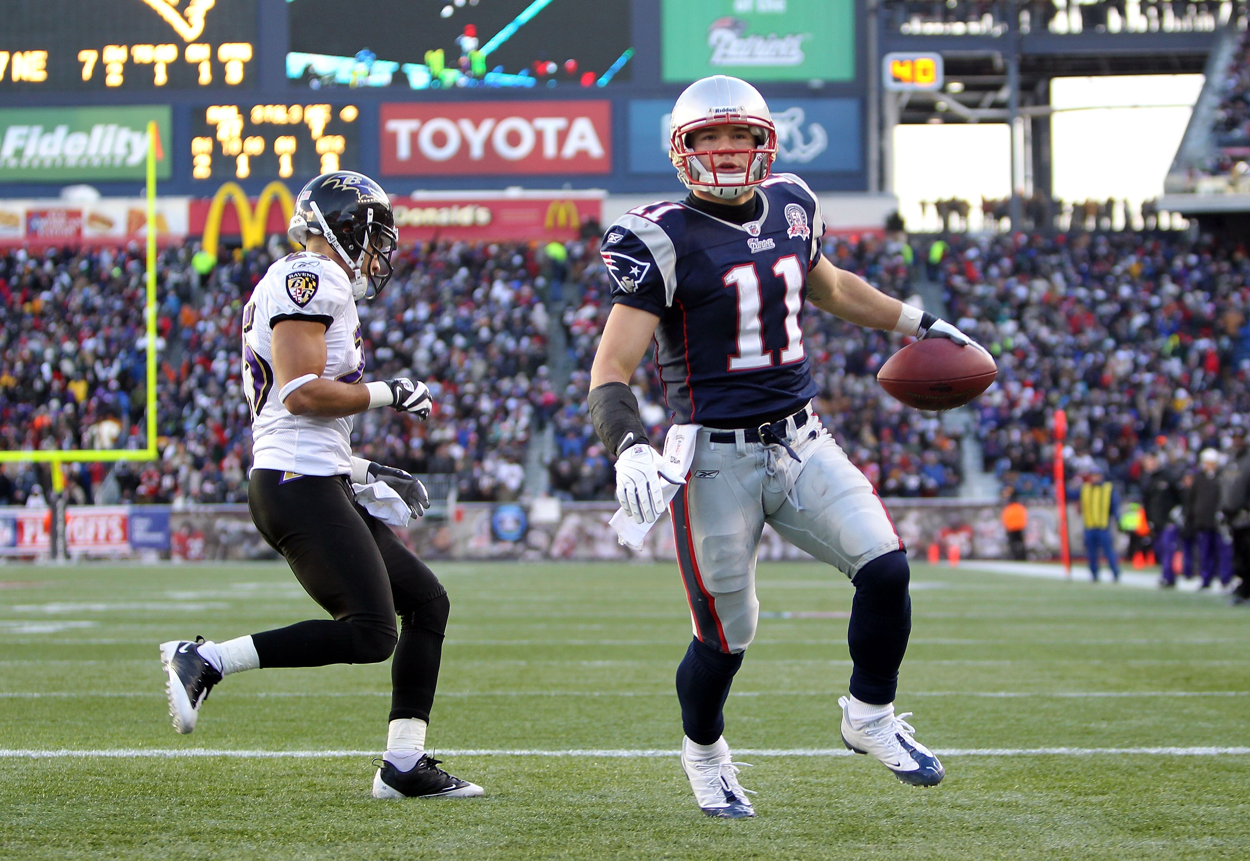 FOXBORO, MA - JANUARY 10:  Julian Edelman #11 of the New England Patriots reacts after he scored a 1-yard touchdown reception in the third quarter  against Chris Carr #25 of the Baltimore Ravens during the 2010 AFC wild-card playoff game at Gillette Stadi