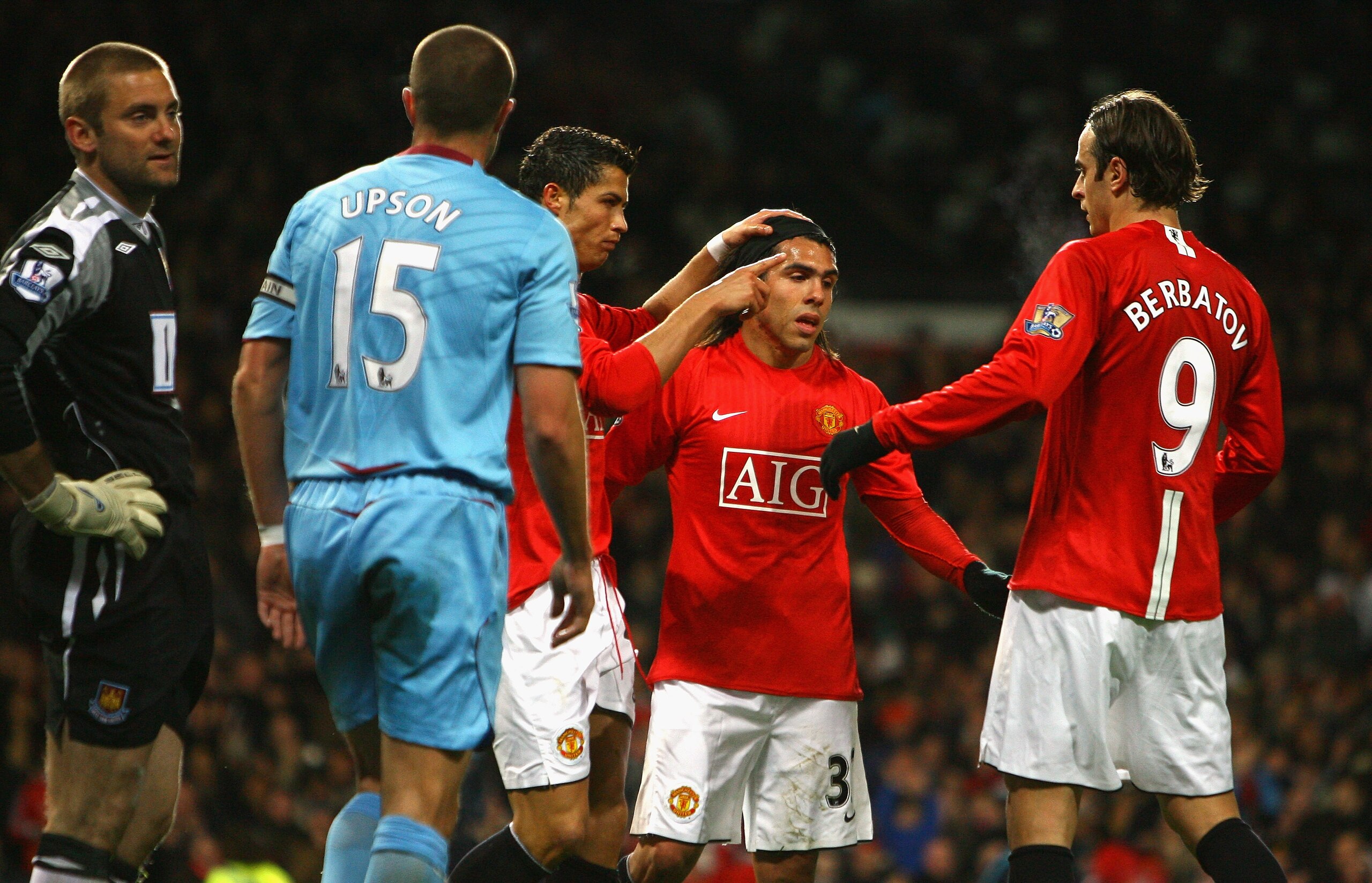 MANCHESTER, UNITED KINGDOM - OCTOBER 29:  Cristiano Ronaldo of Manchester United celebrates with Carlos Tevez and Dimitar Berbatov after scoring his second goal as Robert Green and Matthew Upson of West Ham United look on during the Barclays Premier Leagu