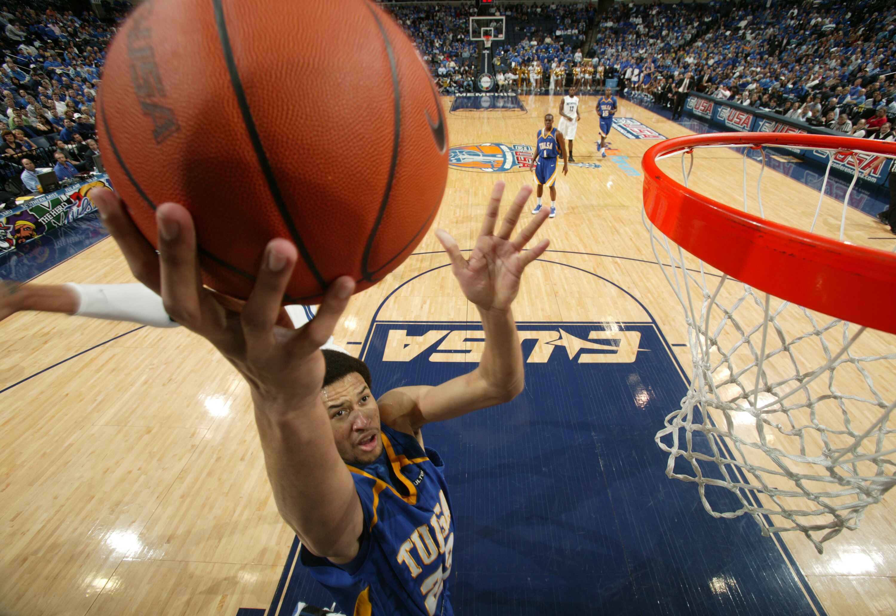 MEMPHIS, TN - MARCH 14: Jerome Jordan #23 of the Tulsa Golden Hurricane drives to the basket in a game against the Memphis Tigers during the Championship of the Conference USA Basketball Tournament at FedExForum on March 14, 2009 in Memphis, Tennessee. (P