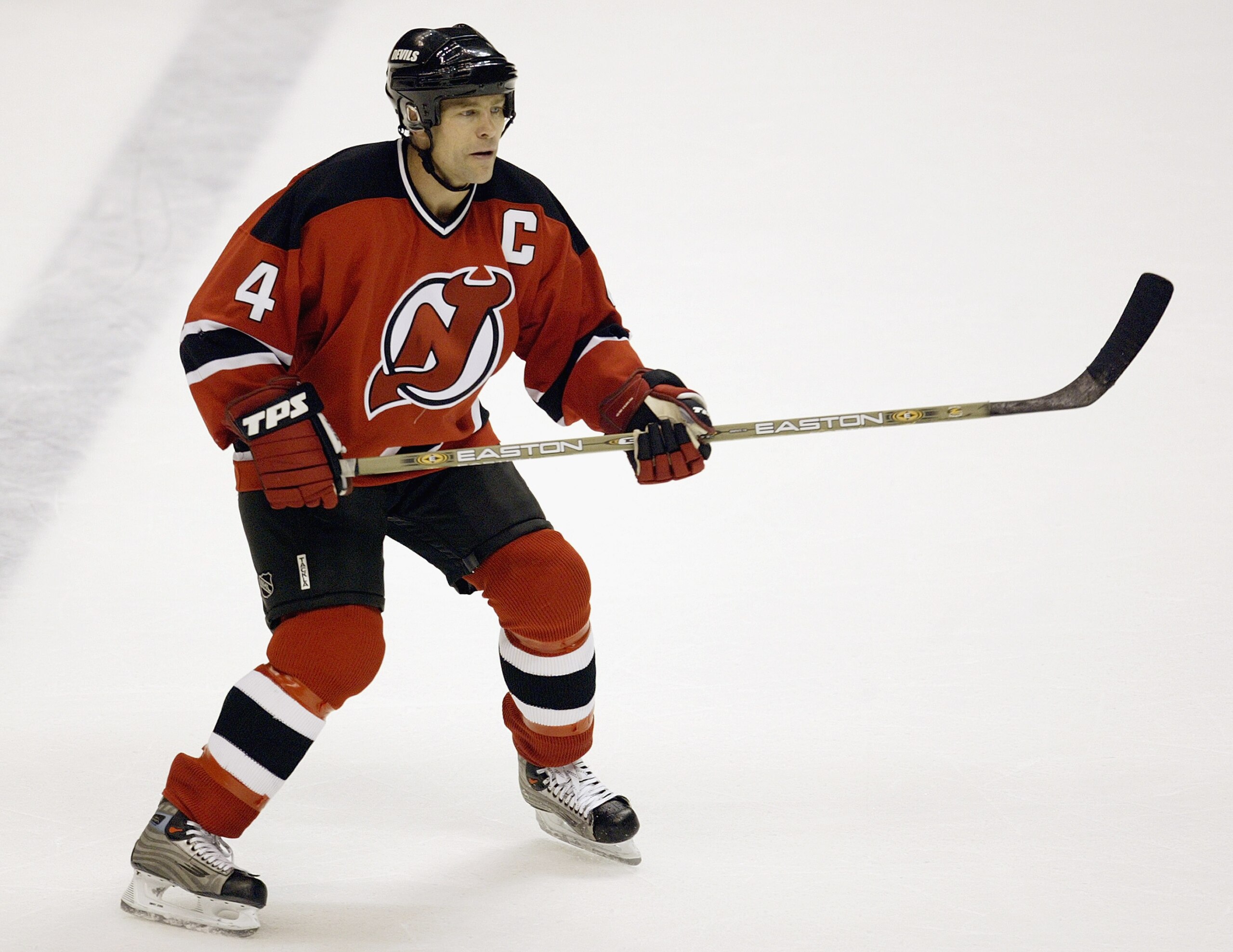 EAST RUTHERFORD, NJ - OCTOBER 16:  Defenseman Scott Stevens #4 of the New Jersey Devils looks for a pass against the Toronto Maple Leafs during their NHL game on October 16, 2003 at the Continental Airlines Arena in East Rutherford, New Jersey. The Devils