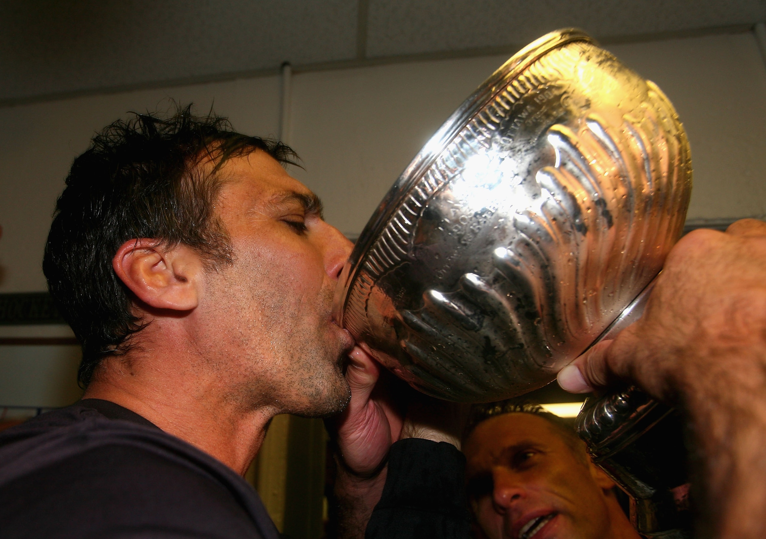 PITTSBURGH - JUNE 04:  Chris Chelios of the Detroit Red Wings drinks from the Stanley Cup in the locker room after defeating the Pittsburgh Penguins in game six of the 2008 NHL Stanley Cup Finals at Mellon Arena on June 4, 2008 in Pittsburgh. Pennsylvania