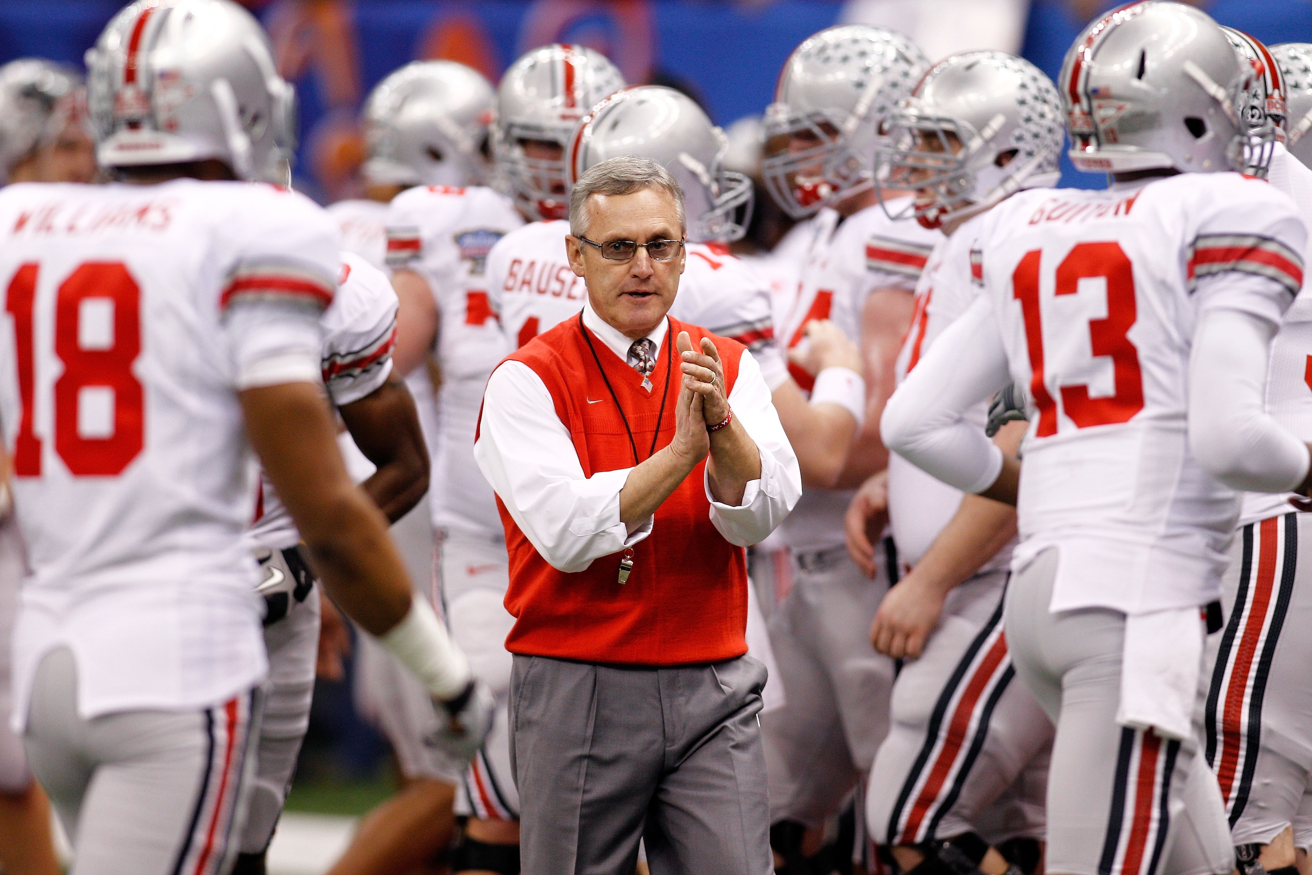 NEW ORLEANS, LA - JANUARY 04:  Head coach Jim Tressel of the Ohio State Buckeyes gathers his team before the Allstate Sugar Bowl against the Arkansas Razorbacks at the Louisiana Superdome on January 4, 2011 in New Orleans, Louisiana.  (Photo by Chris Gray