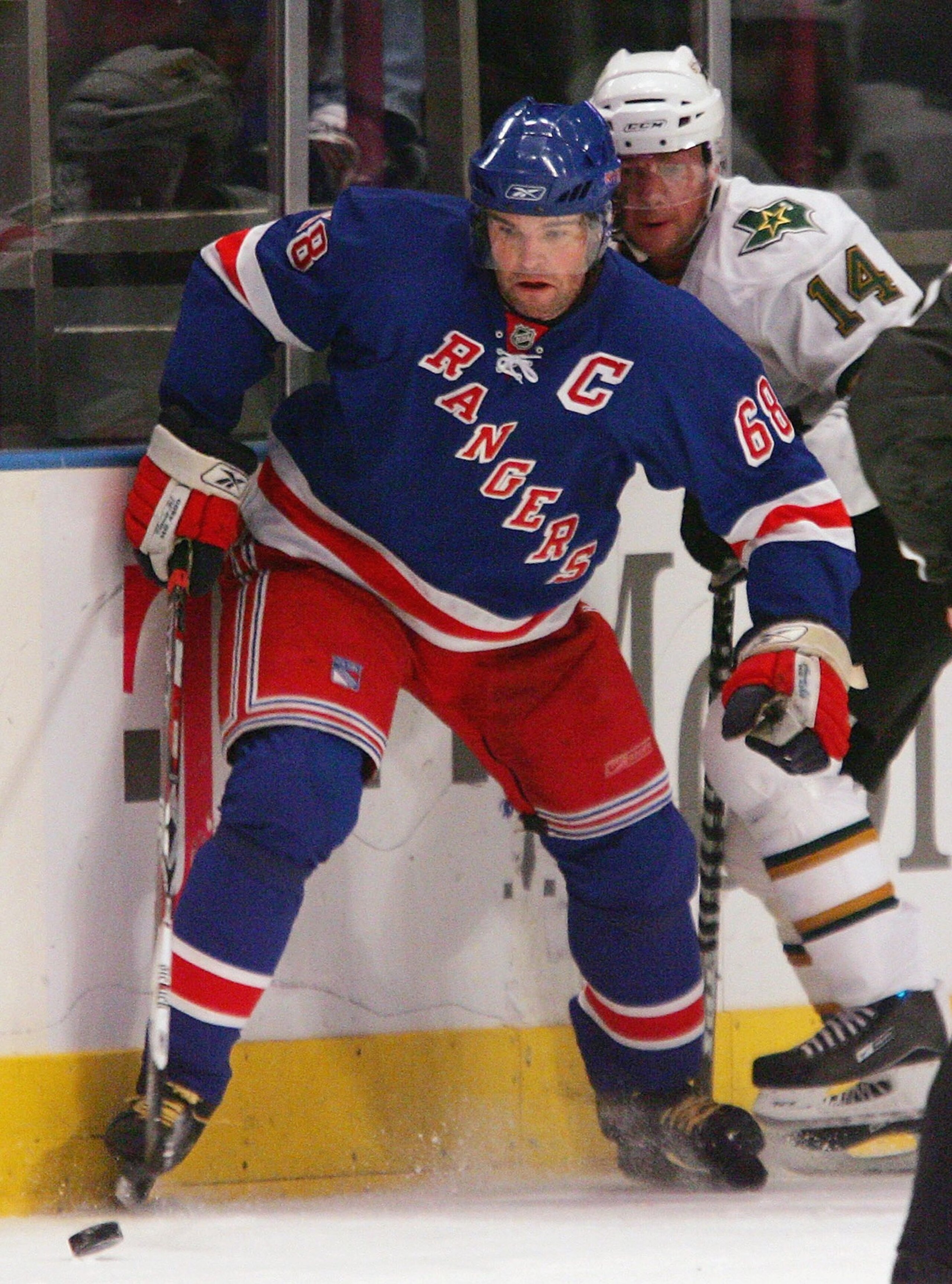 NEW YORK - NOVEMBER 25:  Jaromir Jagr #68 of the New York Rangers eyes the puck as he is defended by Stu Barnes #14 of the Dallas Stars during their NHL game on November 1, 2007 at Madison Square Garden in New York City, New York.  (Photo by: Jim McIsaac/