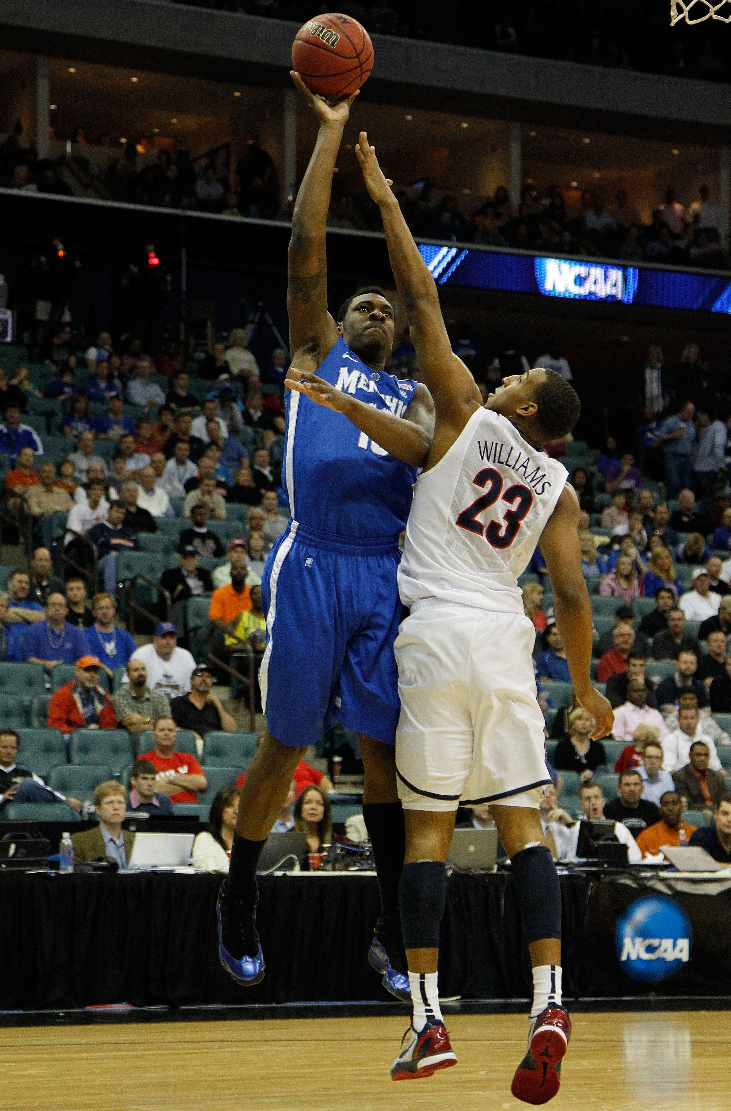 TULSA, OK - MARCH 18:  Tarik Black #10 of the Memphis Tigers takes a shot as Derrick Williams #23 of the Arizona Wildcats defends during the second round game of the 2011 NCAA men's basketball tournament at BOK Center on March 18, 2011 in Tulsa, Oklahoma.