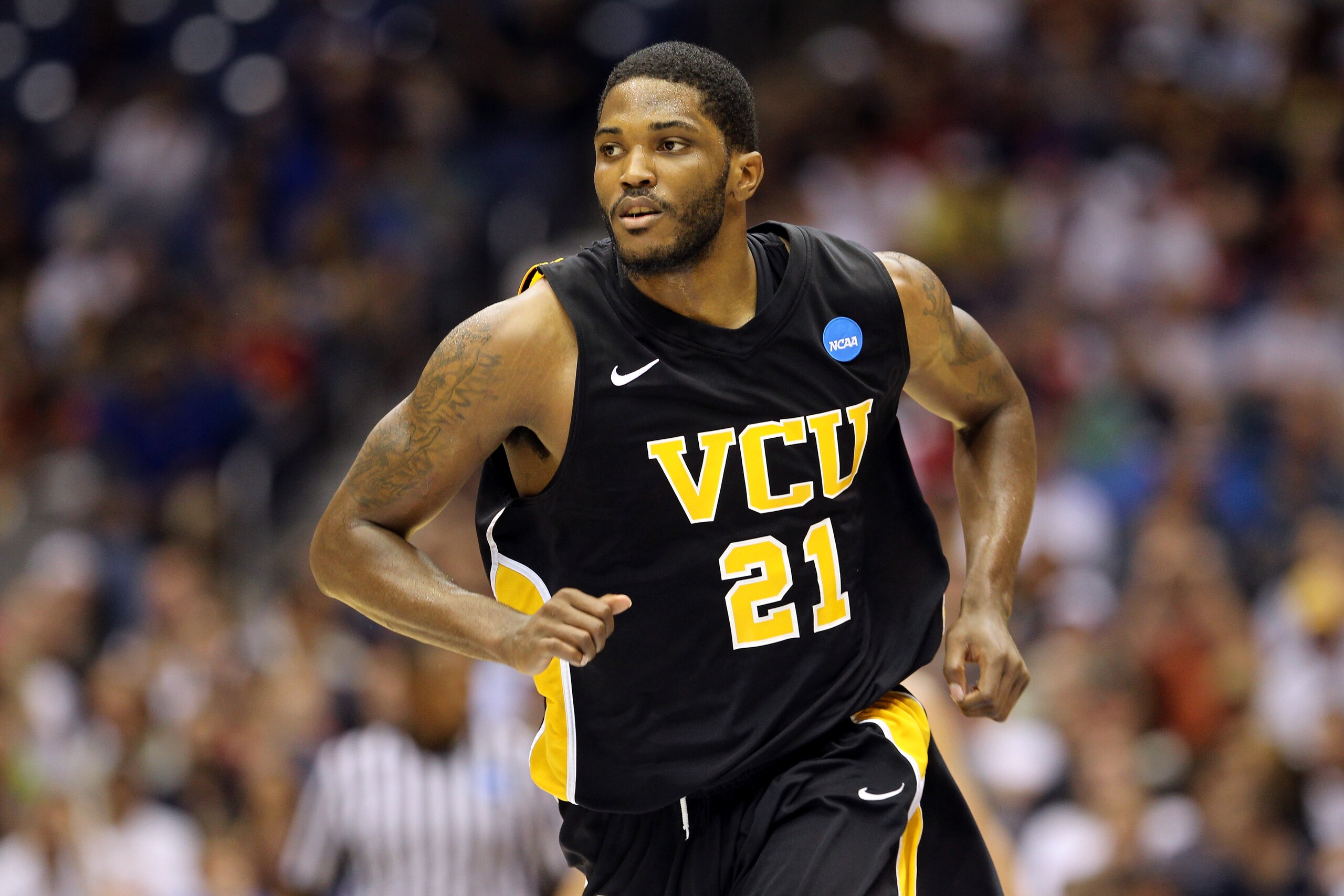 SAN ANTONIO, TX - MARCH 27:  Jamie Skeen #21 of the Virginia Commonwealth Rams runs up court during the southwest regional final of the 2011 NCAA men's basketball tournament against the Kansas Jayhawks at the Alamodome on March 27, 2011 in San Antonio, Te
