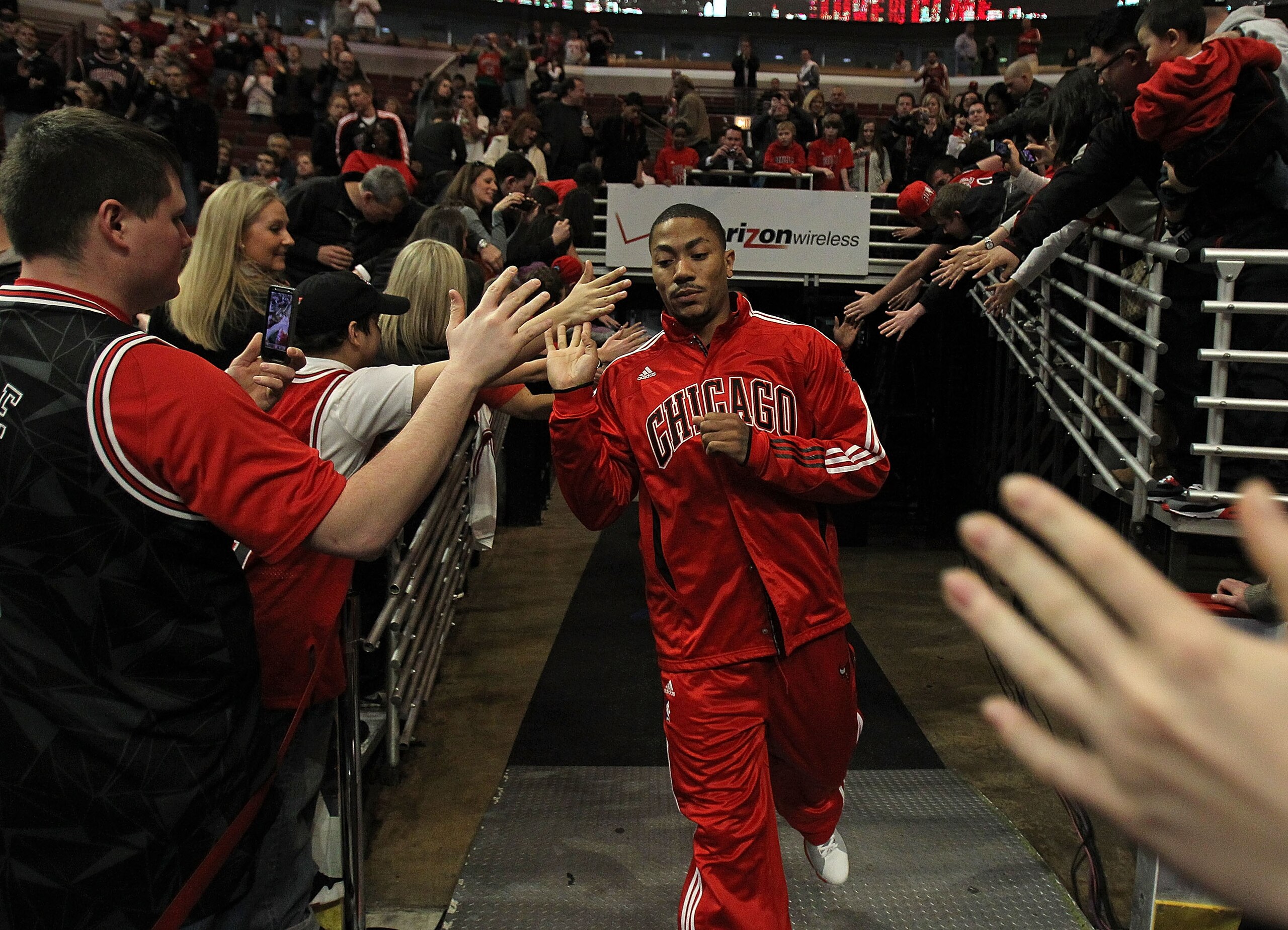 CHICAGO, IL - MARCH 25: Derrick Rose #1 of the Chicago Bulls runs to the court before a game against the Memphis Girzzlies at the United Center on March 25, 2011 in Chicago, Illinois. Rose will donate $1,000.00 for every point he scored tonight to the Dir