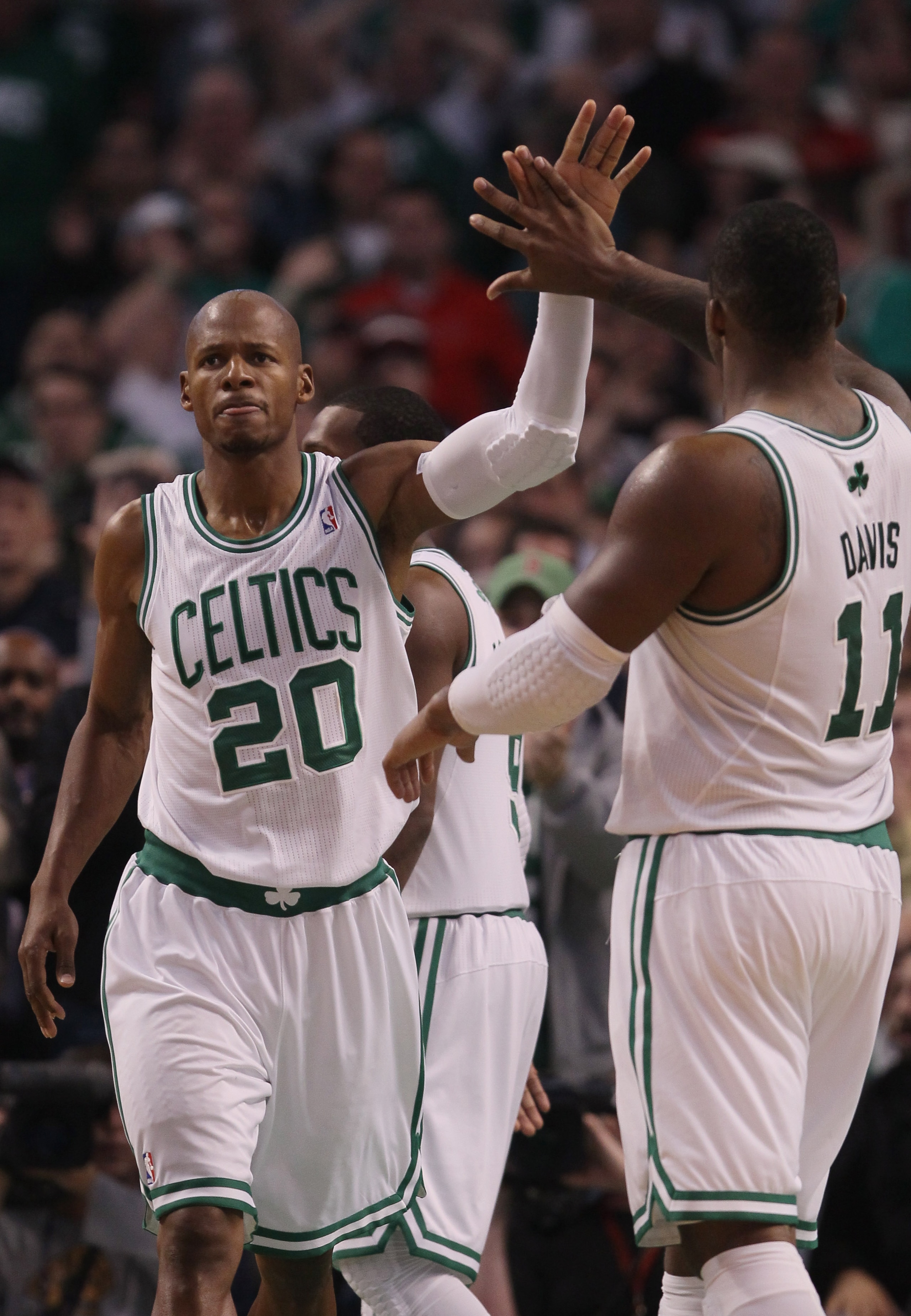 BOSTON - NOVEMBER 05:  Ray Allen #20 of the Boston Celtics is congratulated by teammate Glen Davis #11 after Allen drew the foul in the fourth quarter against the Chicago Bulls on November 5, 2010 at the TD Garden in Boston, Massachusetts. The Celtics def